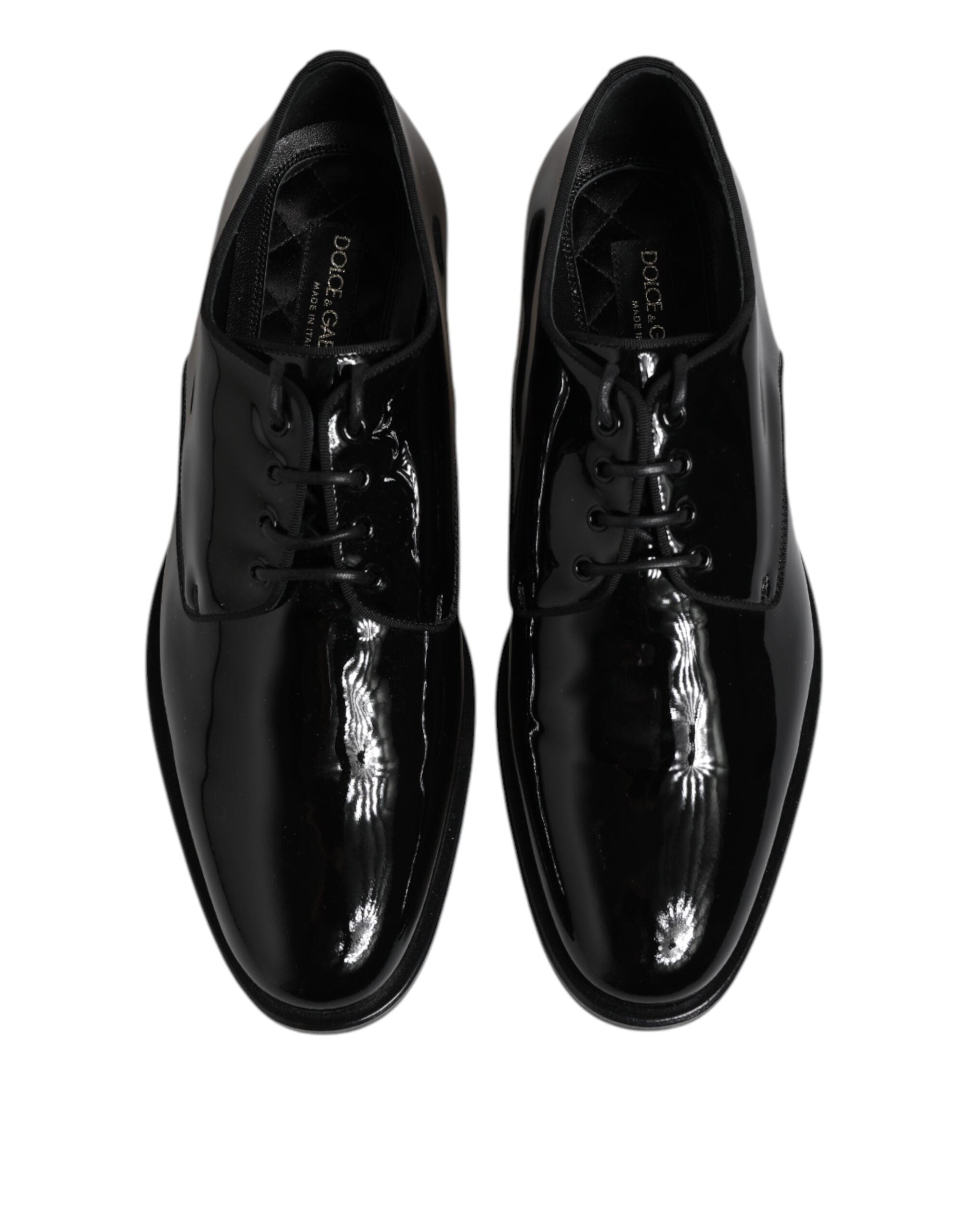 Experience the exquisite craftsmanship of Dolce & Gabbana Black Patent Leather Derby Formal Dress Shoes, where timeless elegance meets modern sophistication for the discerning individual.