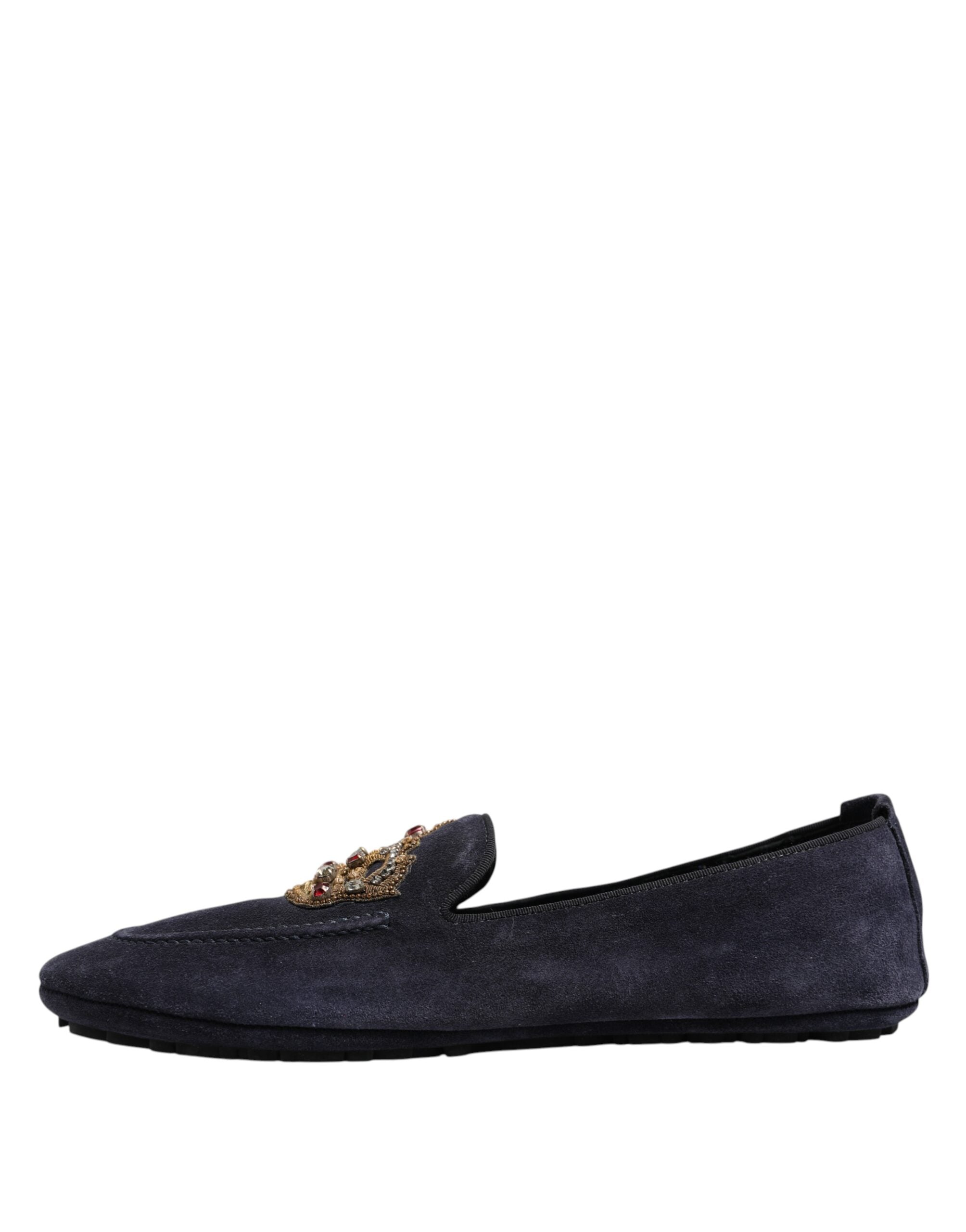 Indulge in the exquisite craftsmanship of Dolce & Gabbana Blue Suede Crown Crystal Loafers, where luxurious materials meet bold individuality, perfect for the discerning connoisseur.