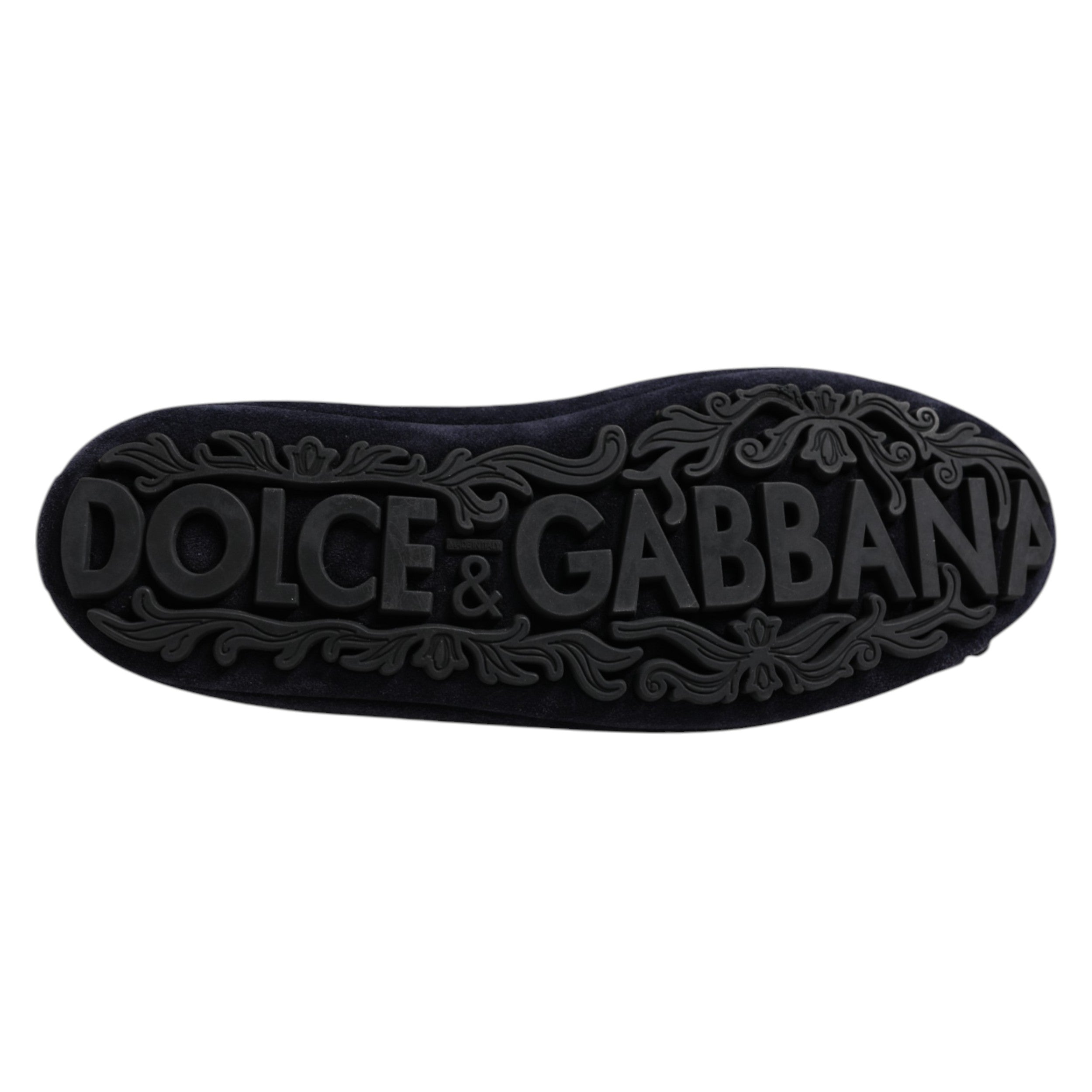 Indulge in the exquisite Dolce & Gabbana Blue Suede Crown Crystal Loafers, where Italian craftsmanship meets luxurious materials, elevating your style with unmatched elegance.