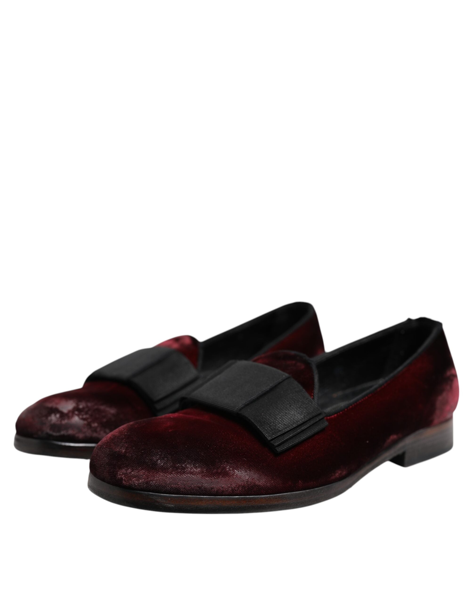 Step into elegance with Dolce & Gabbana Red Velvet Men Slip On Loafers, where luxurious red leather and Italian craftsmanship redefine sophistication for the discerning individual.
