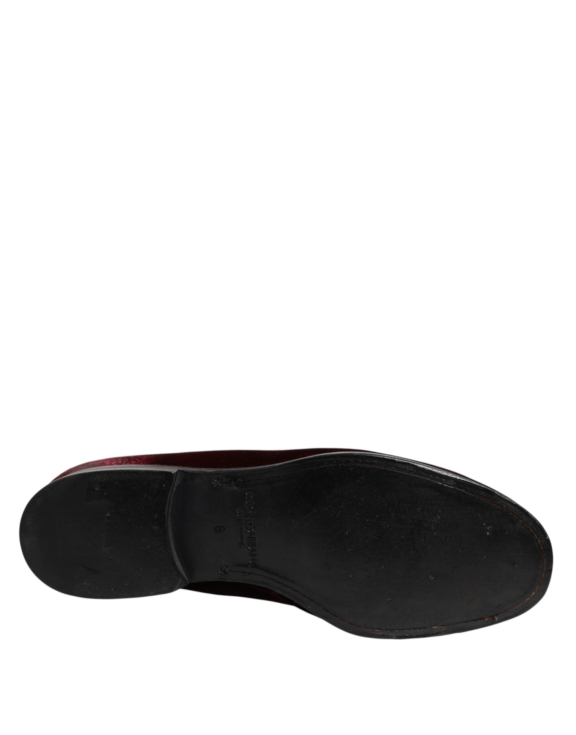 Step into sophistication with Dolce & Gabbana Red Velvet Men Slip On Loafers, where luxurious red leather meets Italian craftsmanship for timeless elegance.