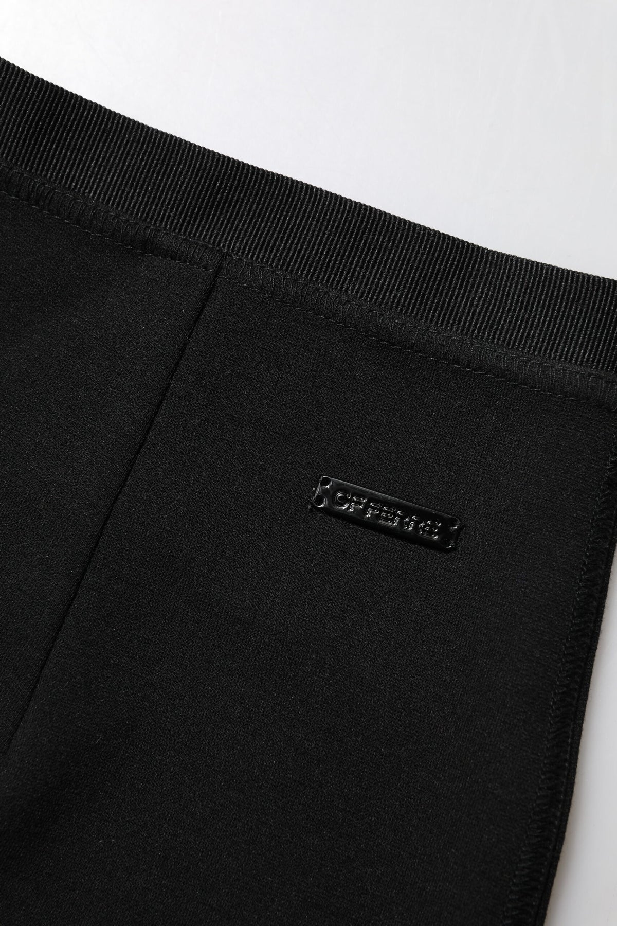 Elevate your wardrobe with the GF Ferre Black Polyester Pencil Cut Knee Length Skirt, a timeless blend of elegance and sophistication, perfect for any refined occasion.