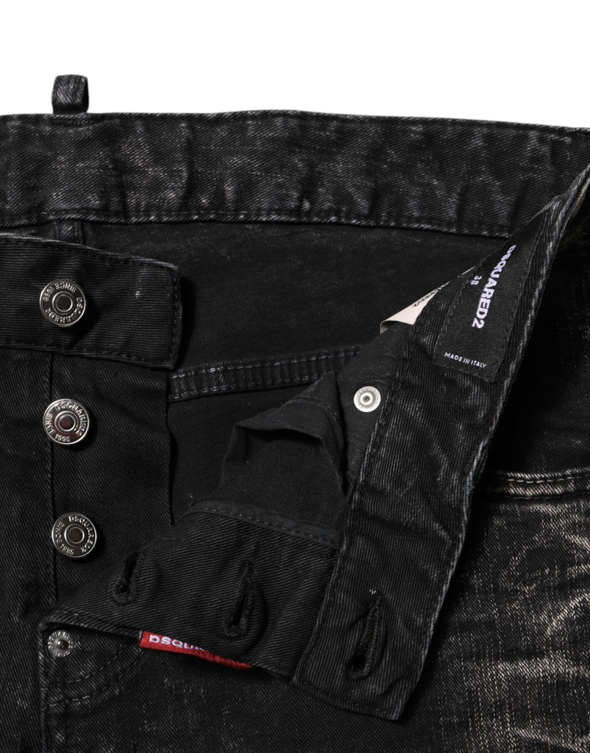 Indulge in the exquisite craftsmanship of Dsquared² Black Washed Mid Waist Tapered Denim Jeans, where luxurious materials meet timeless elegance for a sophisticated silhouette.