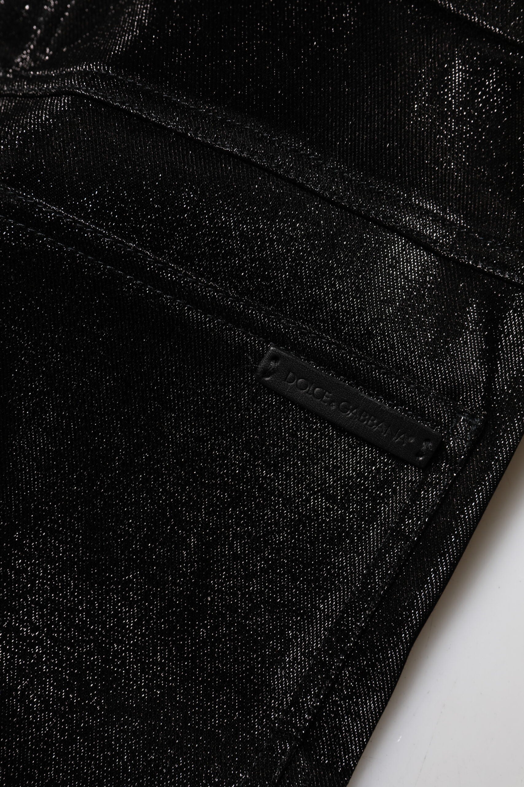 Elevate your style with Dolce & Gabbana's Black Cotton Stretch Silver Lurex Thread Pants, a luxurious blend of elegance and allure, crafted for the discerning individual.