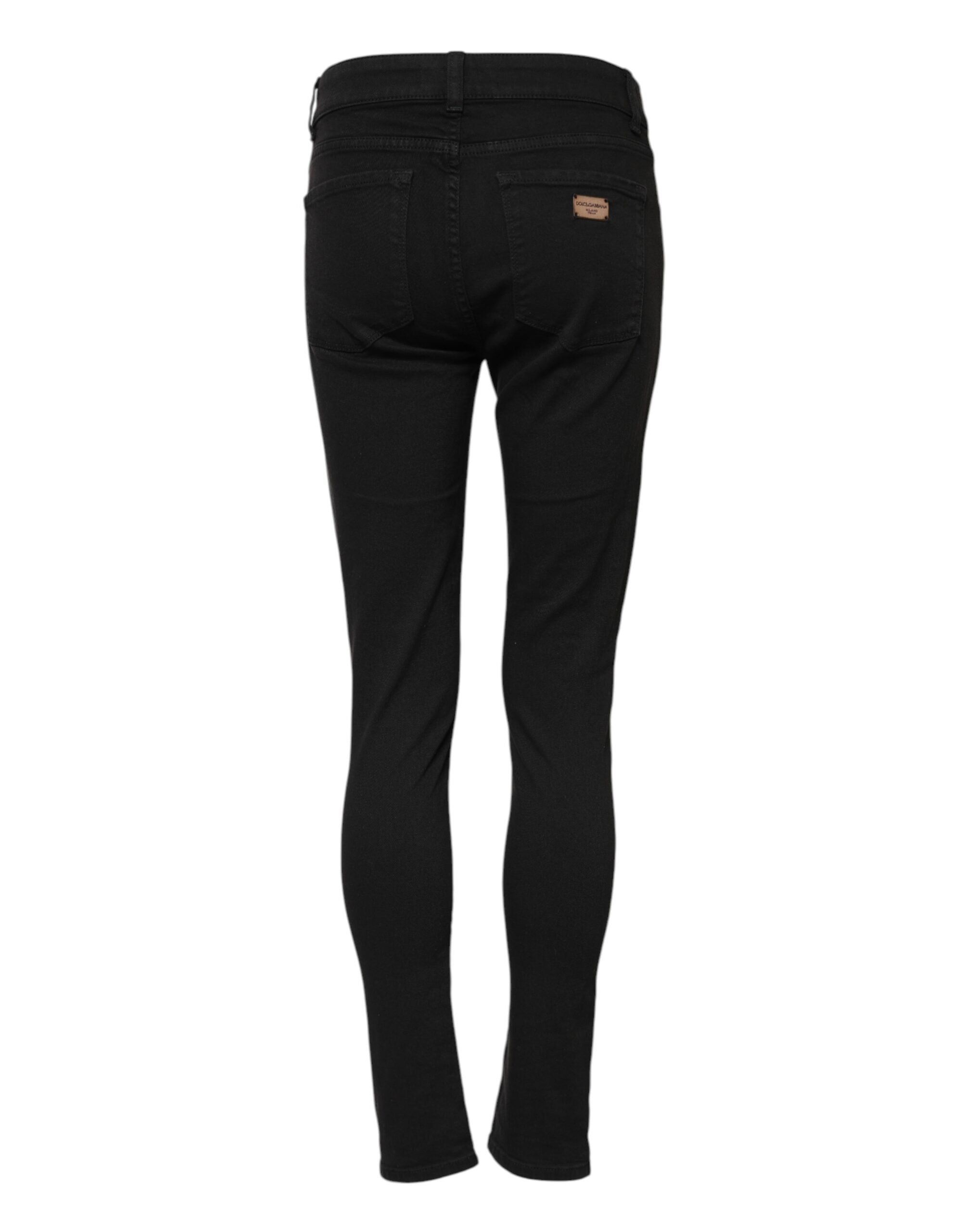 Indulge in the allure of Dolce & Gabbana's Black Cotton Stretch Slim Fit Denim Jeans, where exquisite craftsmanship meets timeless elegance, perfect for the discerning individual.