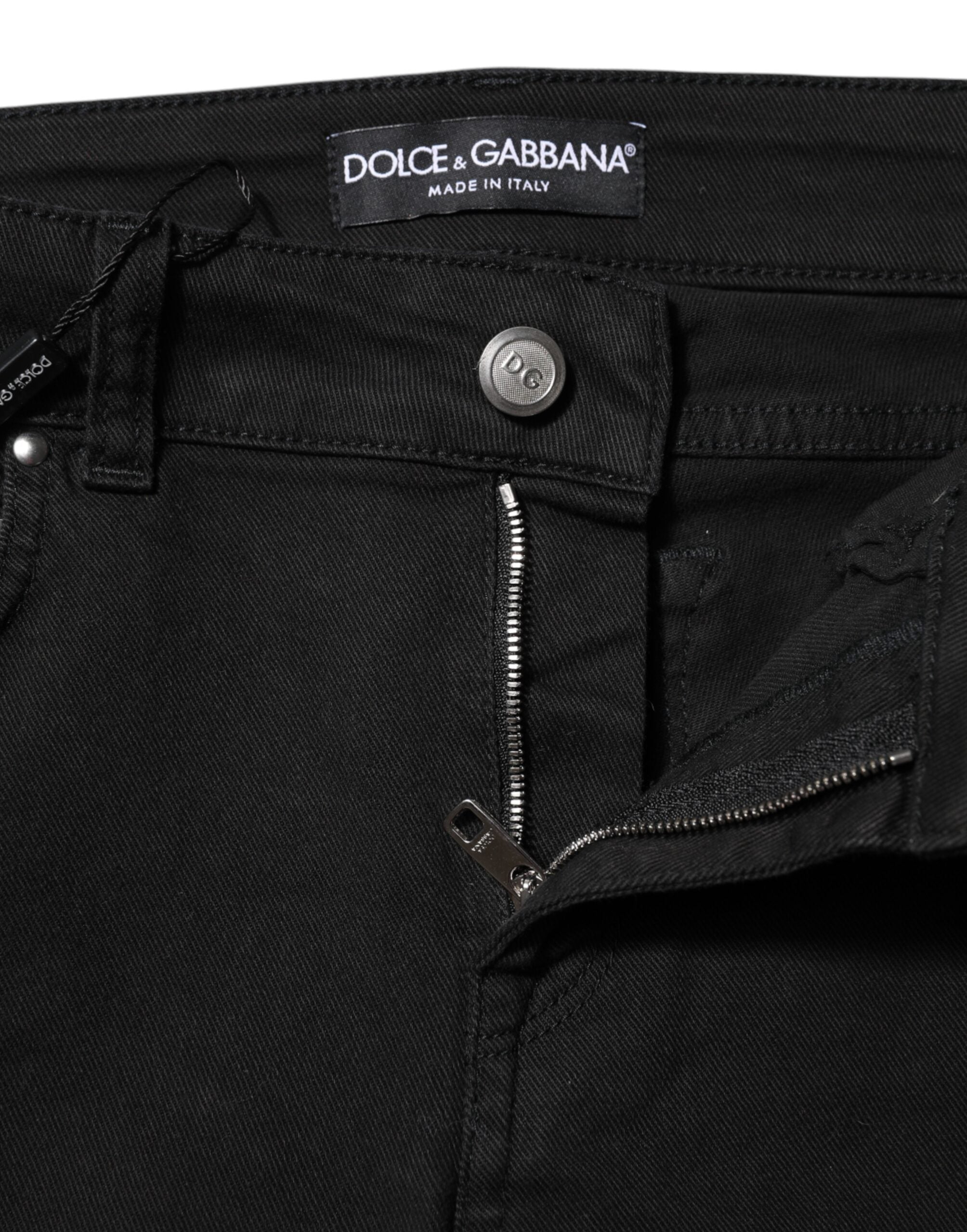 Indulge in the allure of Dolce & Gabbana's Black Cotton Stretch Slim Fit Denim Jeans, where luxurious craftsmanship meets timeless elegance for the discerning individual.