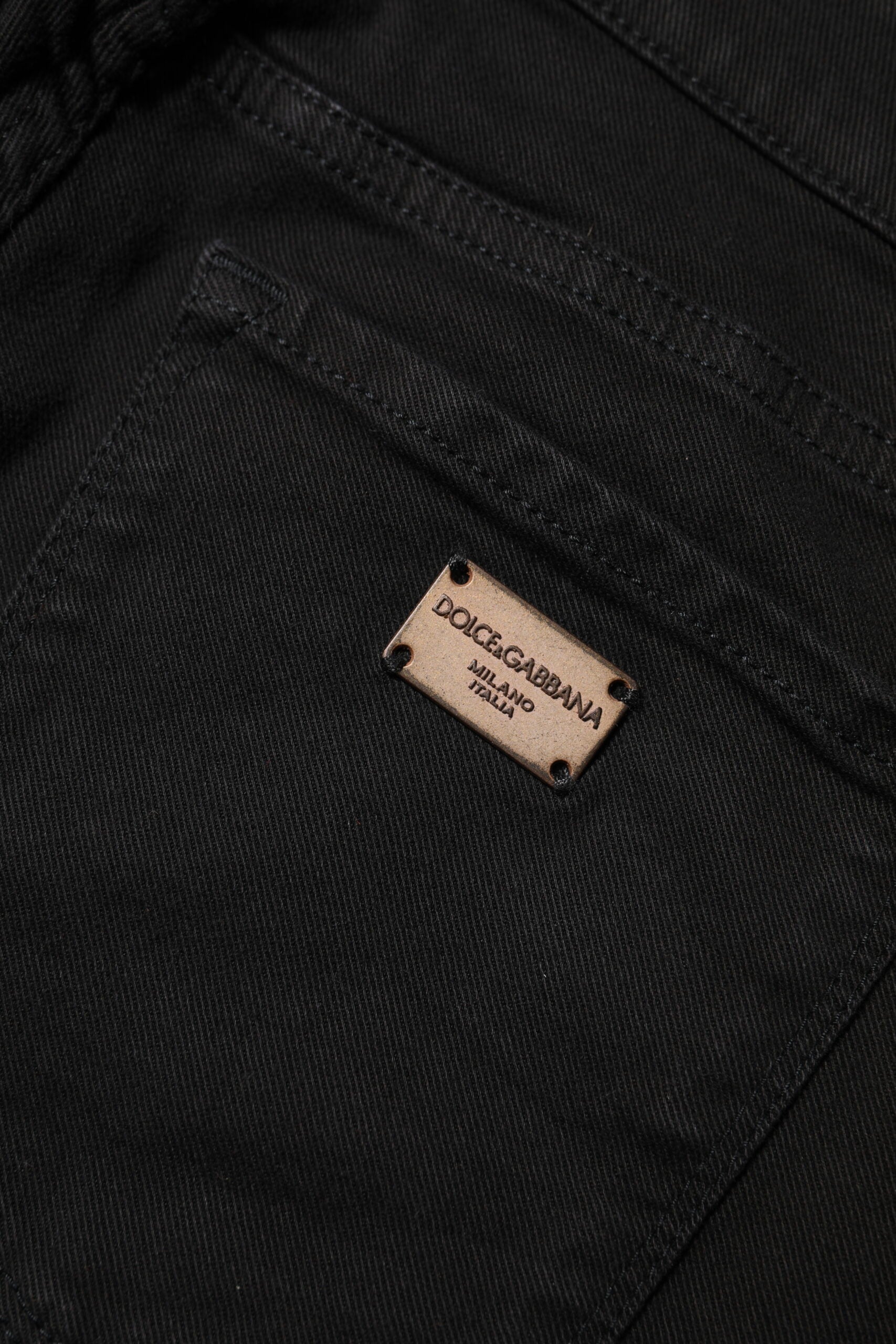Indulge in the allure of Dolce & Gabbana's Black Cotton Stretch Slim Fit Denim Jeans, where exquisite craftsmanship meets luxurious comfort for the discerning individual.