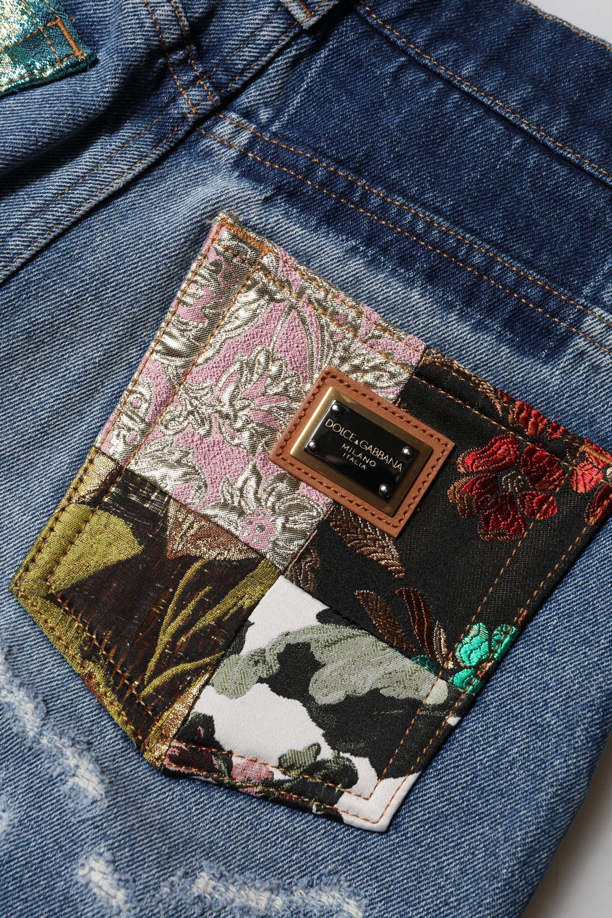 Elevate your wardrobe with Dolce & Gabbana's Blue Cotton Tattered High Waist Denim Jeans, where luxurious craftsmanship meets modern femininity for an unforgettable statement.