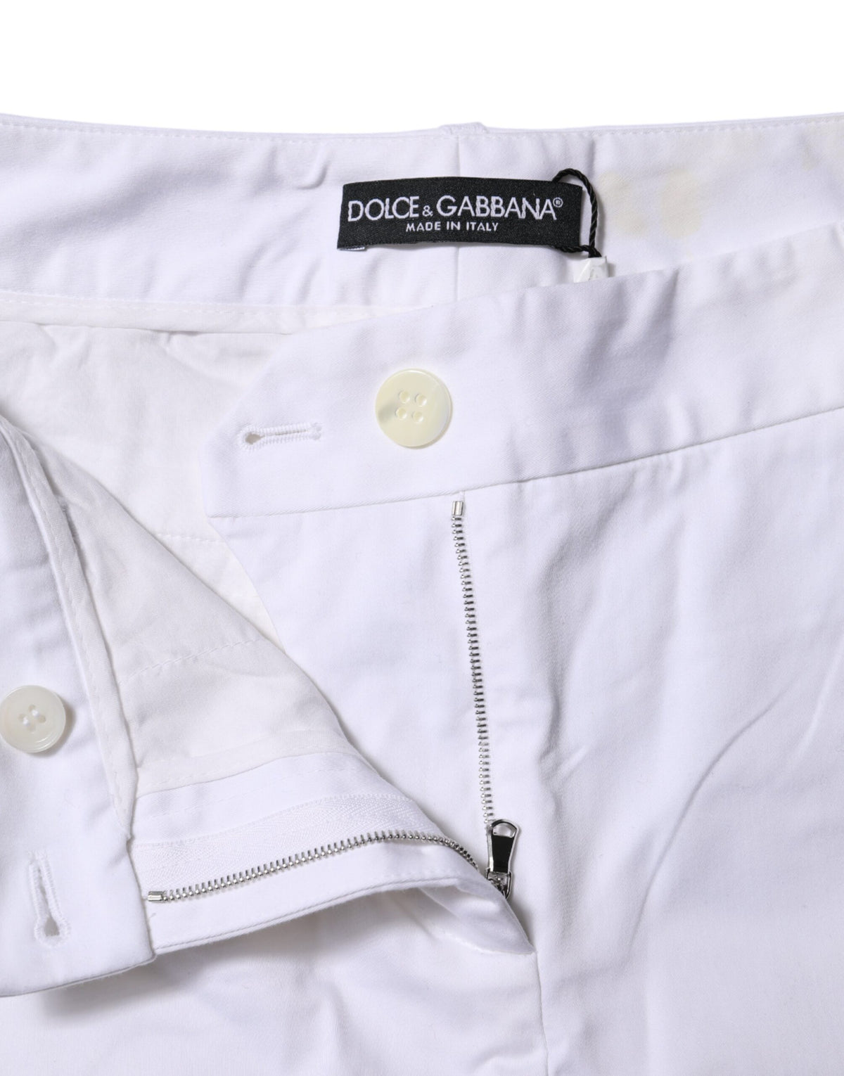 Elevate your wardrobe with Dolce & Gabbana White Cotton Stretch Mid Waist Jeans, where exquisite craftsmanship meets luxurious comfort for timeless elegance.