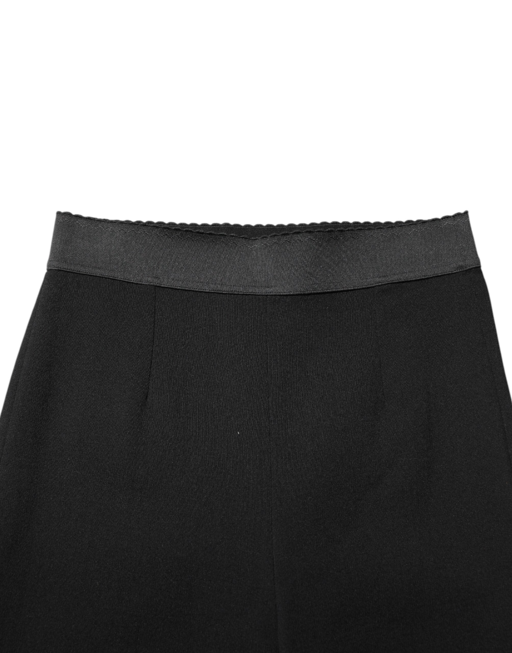 Elevate your wardrobe with Dolce & Gabbana's Black Wool Leggings, crafted from premium virgin wool for a luxurious fit that embodies elegance and sophistication.