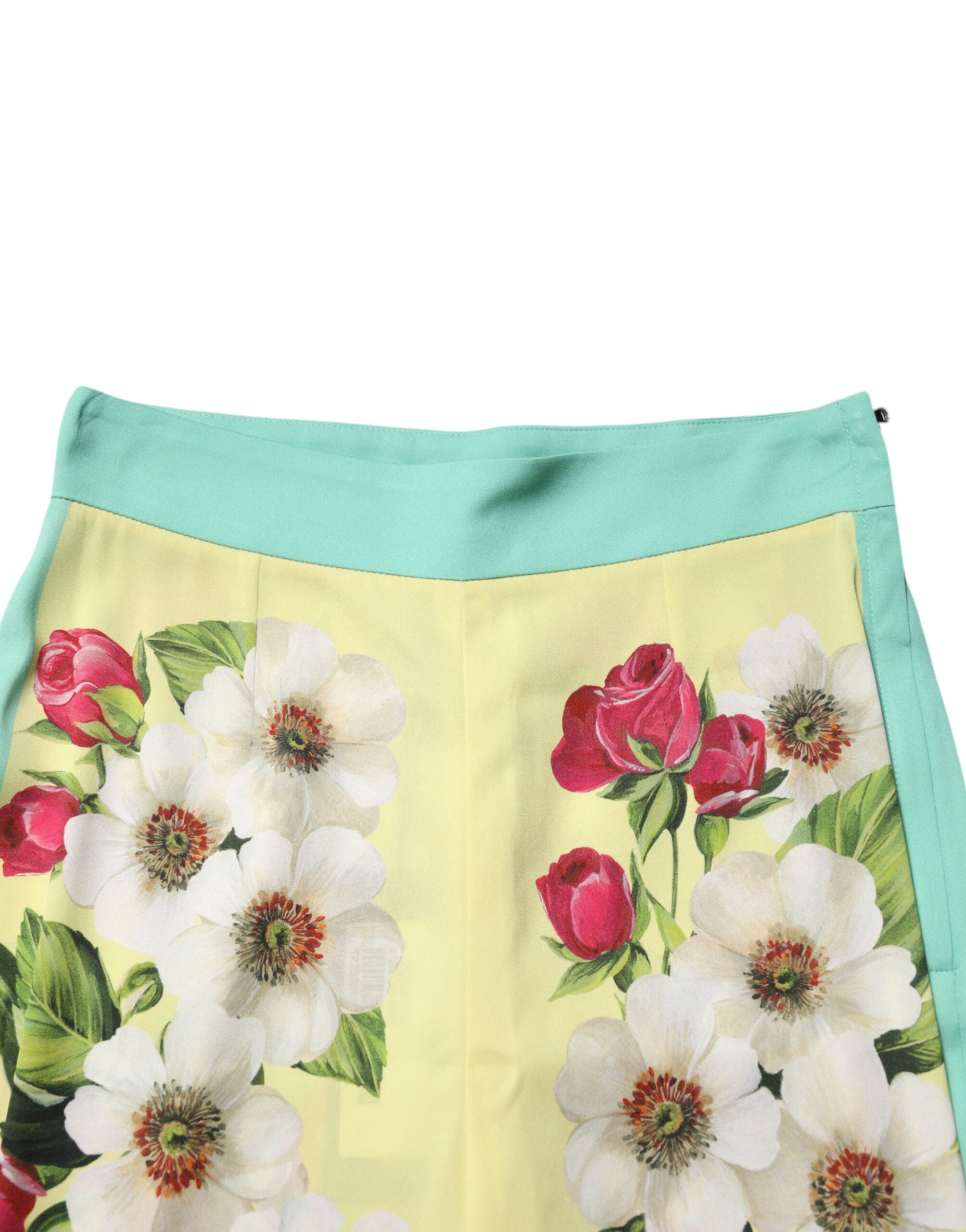 Indulge in the luxurious Dolce & Gabbana Yellow Silk Floral Leggings Pants, where exquisite silk meets Italian craftsmanship, embodying elegance for the discerning individual.
