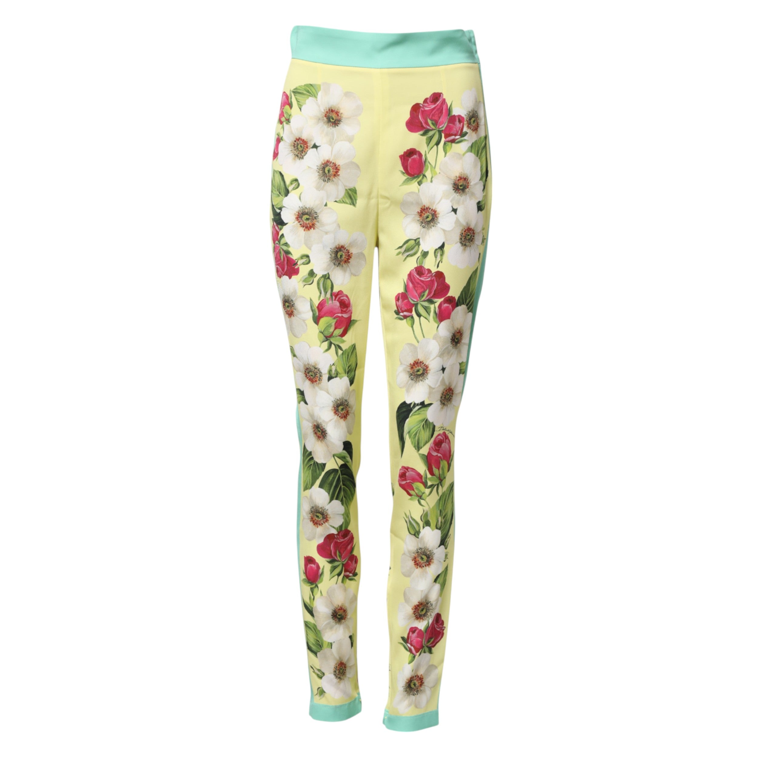 Indulge in the exquisite Dolce & Gabbana Yellow Silk Floral Leggings Pants, where luxurious silk meets captivating design, embodying Italian elegance for the discerning individual.