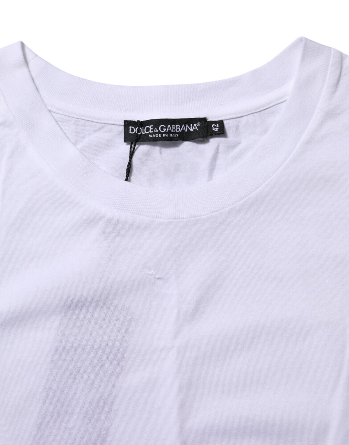 Elevate your wardrobe with the Dolce & Gabbana White Cotton Round Neck T-shirt, a masterpiece of Italian craftsmanship that embodies timeless elegance and versatility.