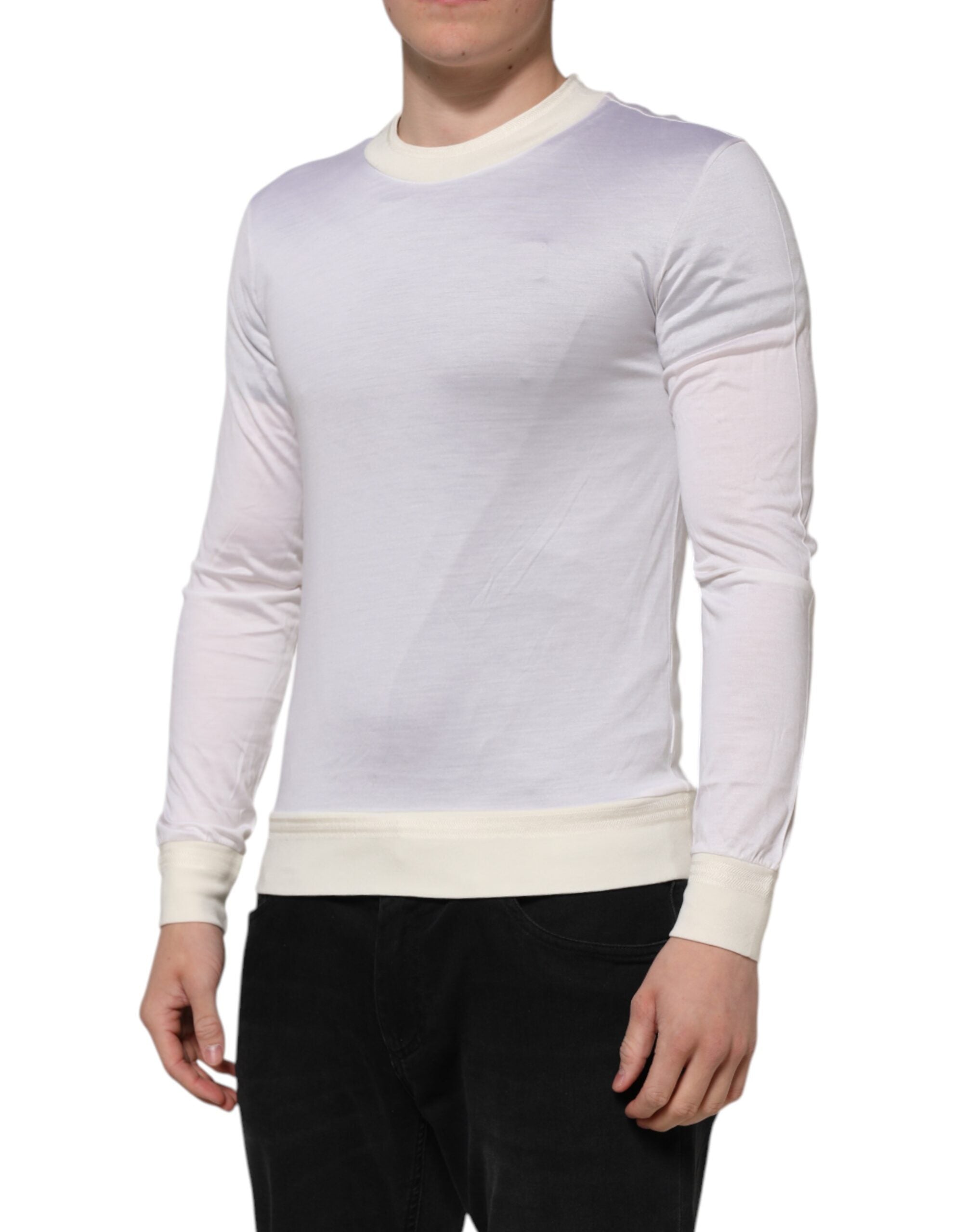 Discover the Dolce & Gabbana White Silk Crew Neck Long Sleeves T-shirt, a masterpiece of Italian craftsmanship that embodies timeless elegance and luxurious allure.