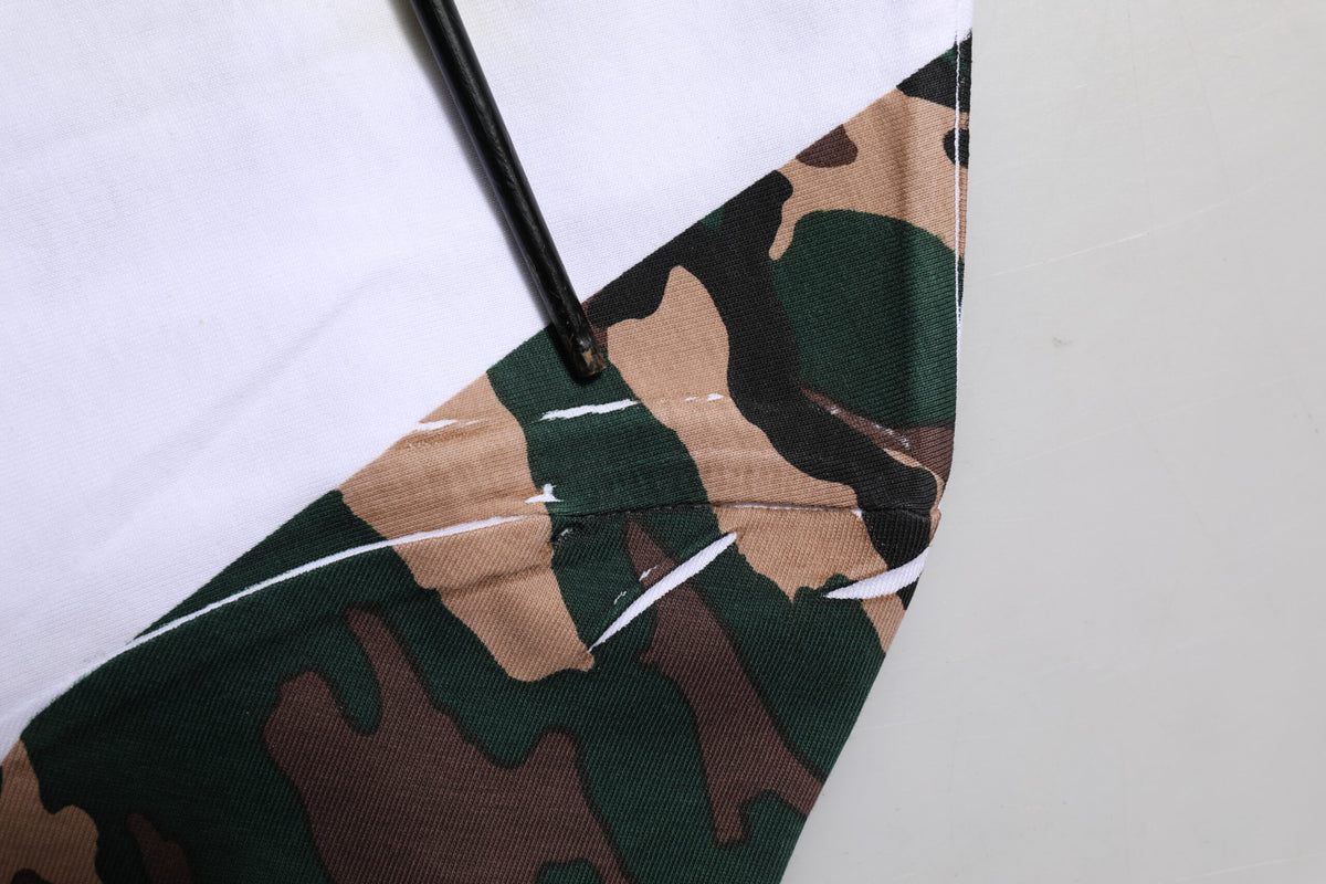 Indulge in the exquisite Dolce & Gabbana White Camouflage Cotton Men Crew Neck T-shirt, a luxurious blend of comfort and style, crafted for those who embody elegance and sophistication.