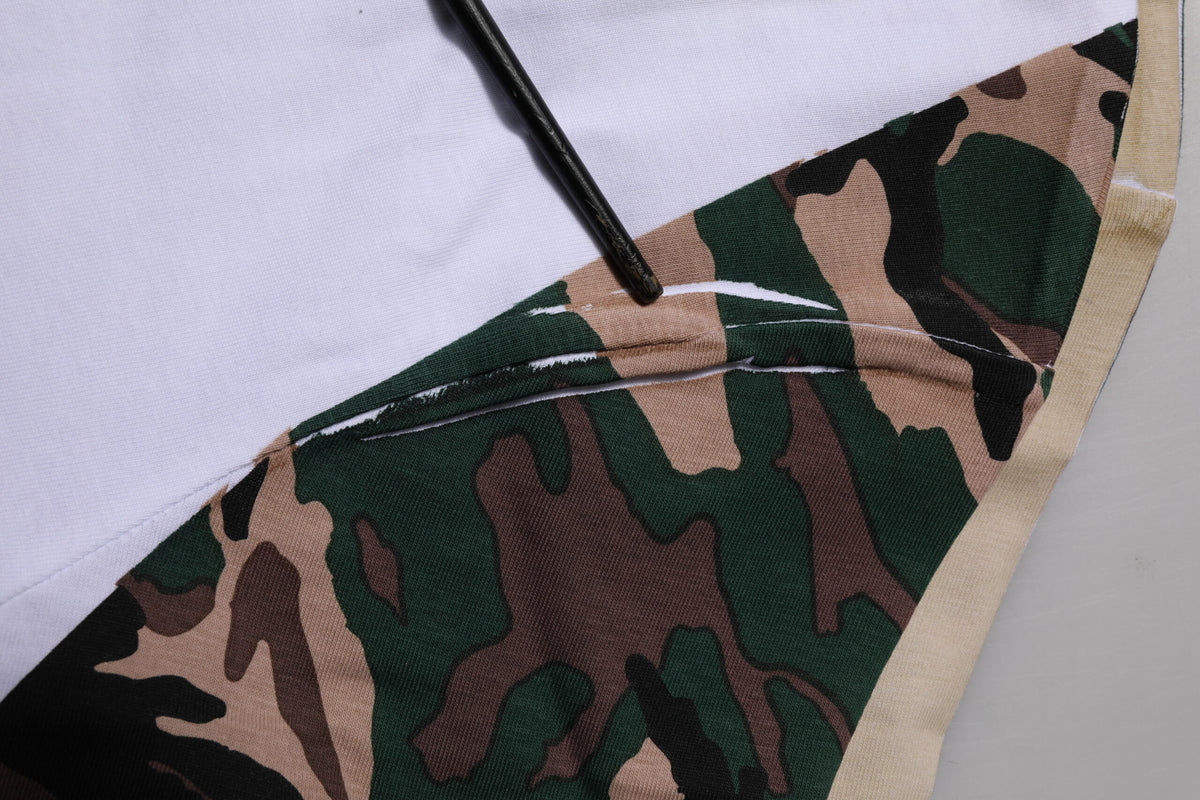 Elevate your wardrobe with the Dolce & Gabbana White Camouflage Cotton Crew Neck T-shirt, a fusion of luxurious craftsmanship and contemporary elegance, perfect for discerning tastes.