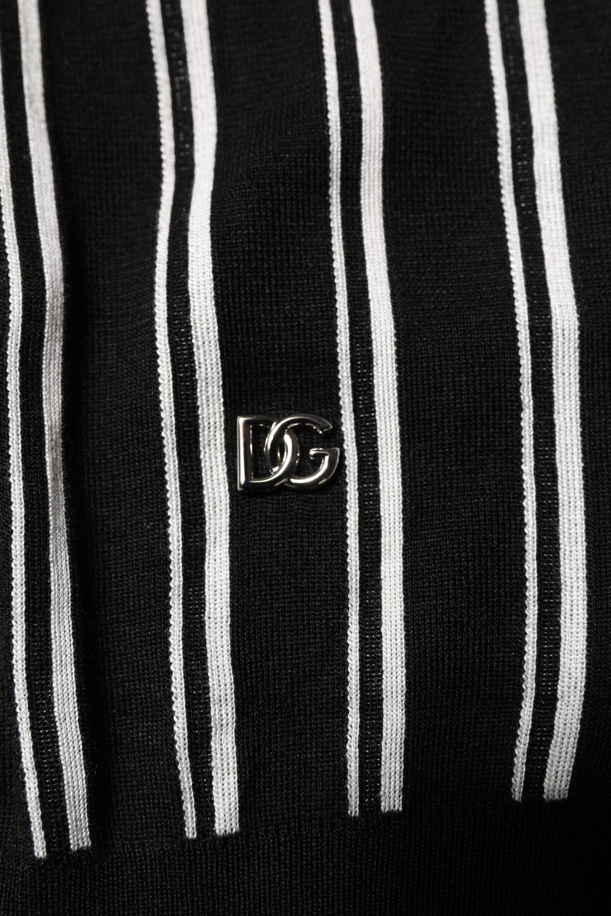 Elevate your wardrobe with the Dolce & Gabbana Black White Stripes Collared Polo T-shirt, a silk masterpiece that embodies Italian craftsmanship and timeless elegance.