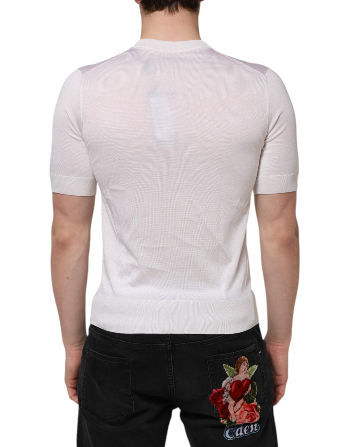Elevate your wardrobe with the Dolce & Gabbana White Silk Henley T-shirt, a masterpiece of Italian craftsmanship that embodies timeless elegance and luxurious comfort.