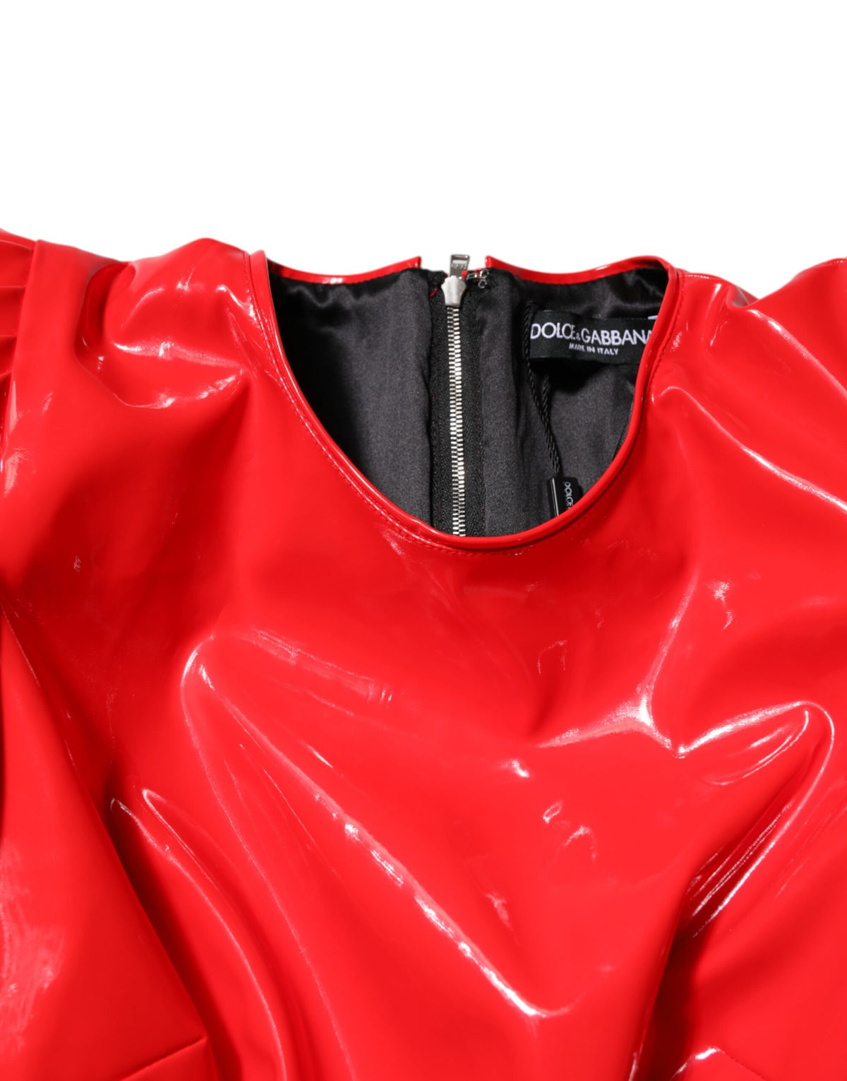 Indulge in the allure of the Dolce & Gabbana Red Patent Leather Puff Sleeves Mini Dress, where exquisite craftsmanship meets timeless elegance for the discerning fashionista.