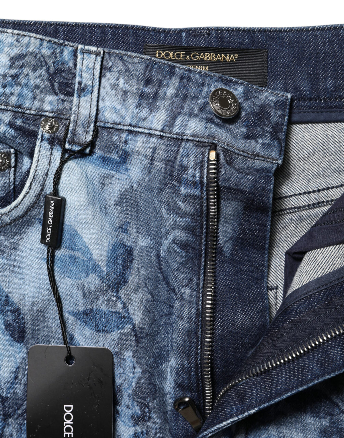 Indulge in the exquisite Dolce & Gabbana Blue Floral Print Denim Cotton Hot Pants, a celebration of Italian craftsmanship that elevates your summer elegance and allure.