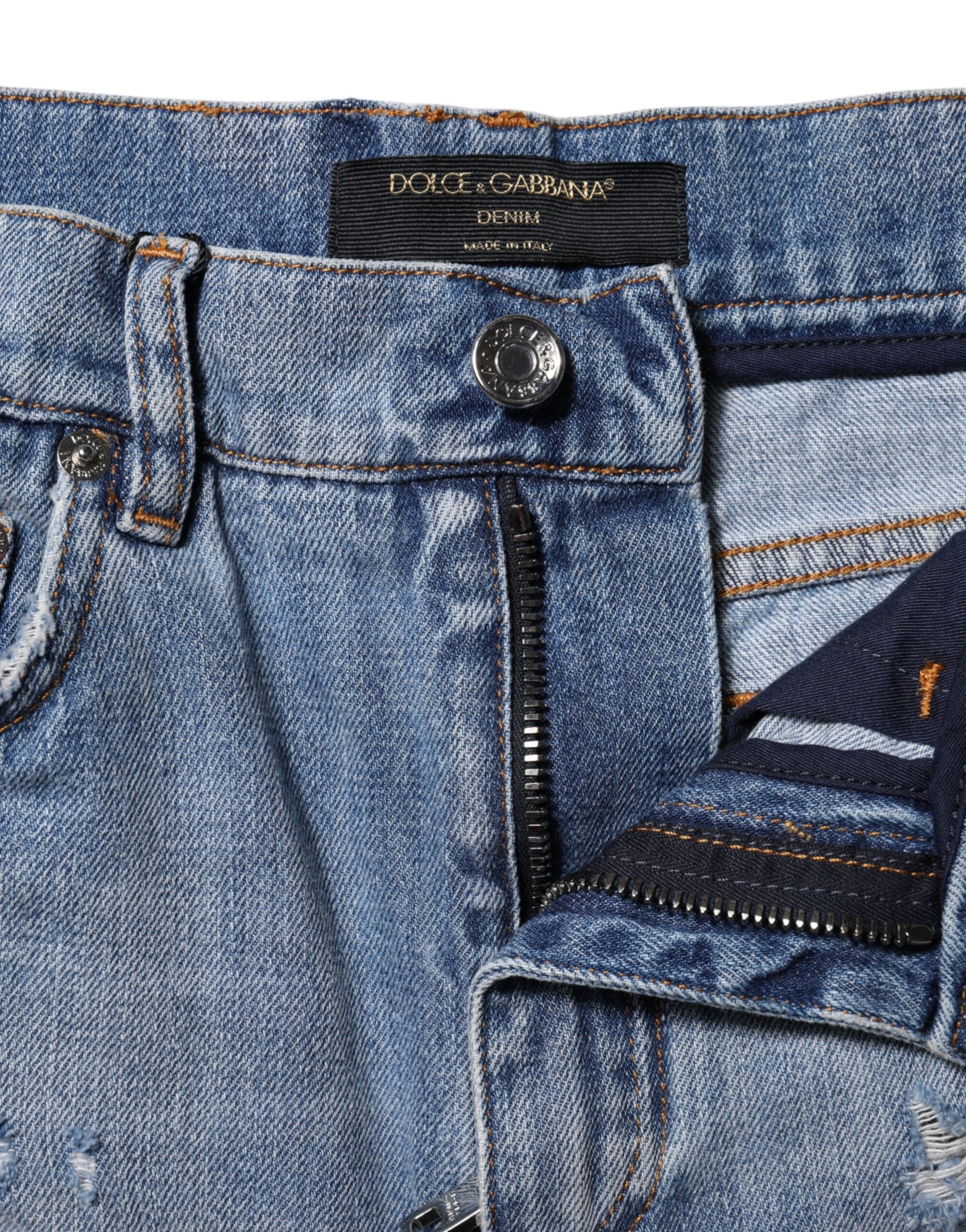 Elevate your wardrobe with Dolce & Gabbana's Blue Logo Plaque Denim Cotton Hot Pants, a luxurious blend of Italian craftsmanship and timeless style, perfect for the discerning individual.