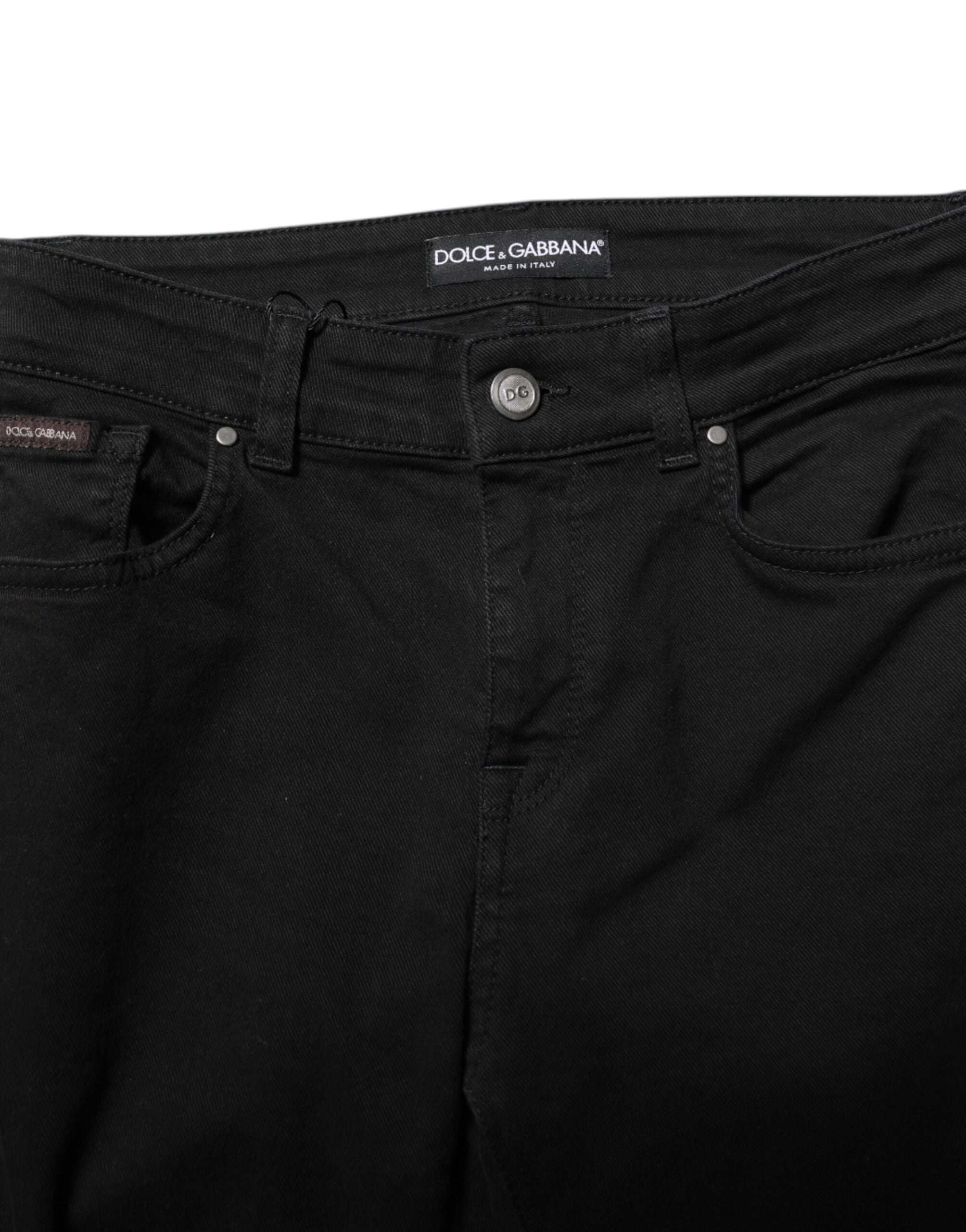 Elevate your wardrobe with Dolce & Gabbana's Black Cotton Logo Skinny Mid Waist Denim Jeans, where exquisite Italian craftsmanship meets timeless elegance for the discerning individual.