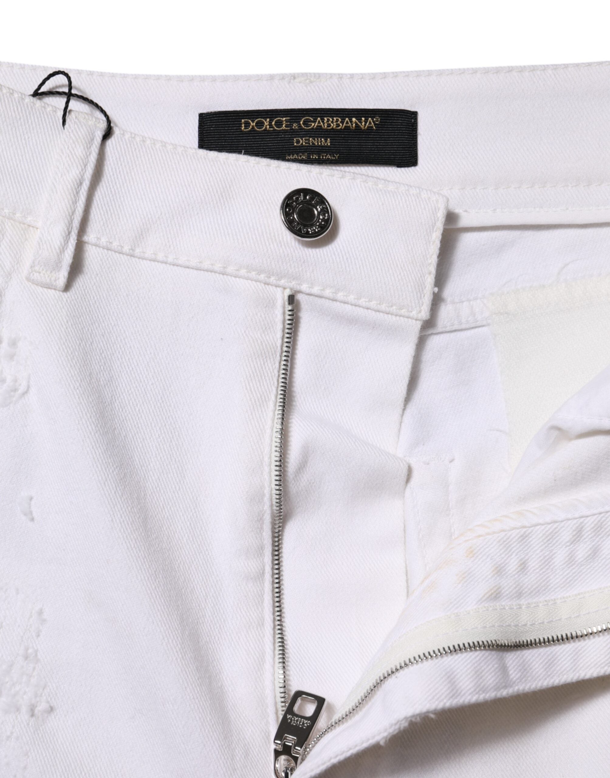 Indulge in the exquisite Dolce & Gabbana White Tattered Cotton High Waist Denim Jeans, where Italian craftsmanship meets luxurious comfort, perfect for the discerning individual.