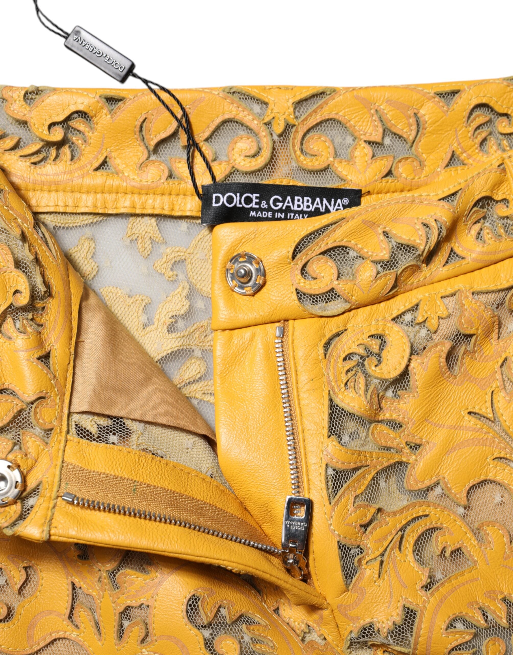 Indulge in the exquisite Dolce & Gabbana Yellow Floral Lace Mid Waist Capri Pants, crafted from premium bull leather, embodying luxury and sophistication for every occasion.