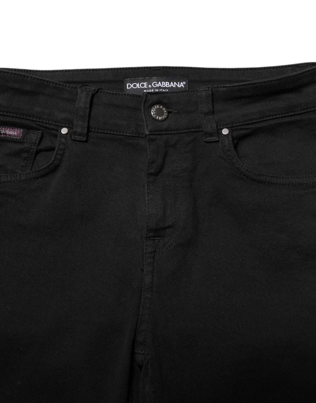 Indulge in the exquisite Dolce & Gabbana Black Cotton Skinny Mid Waist Denim Jeans, where luxurious craftsmanship meets timeless elegance, perfect for the discerning individual.