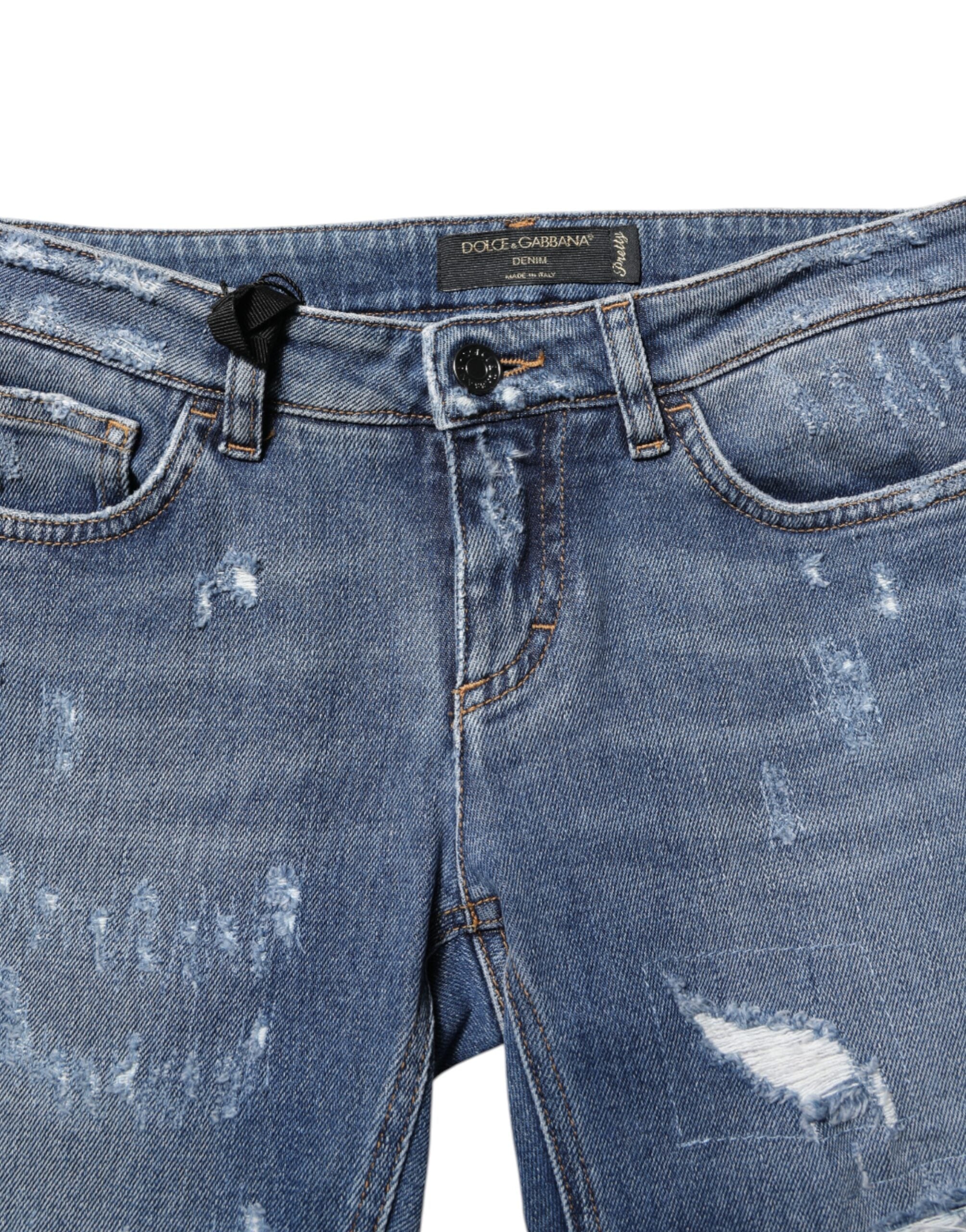 Elevate your wardrobe with Dolce & Gabbana's Blue PRETTY Tattered Skinny Denim Jeans, crafted from premium cotton for a flawless silhouette that embodies modern elegance.