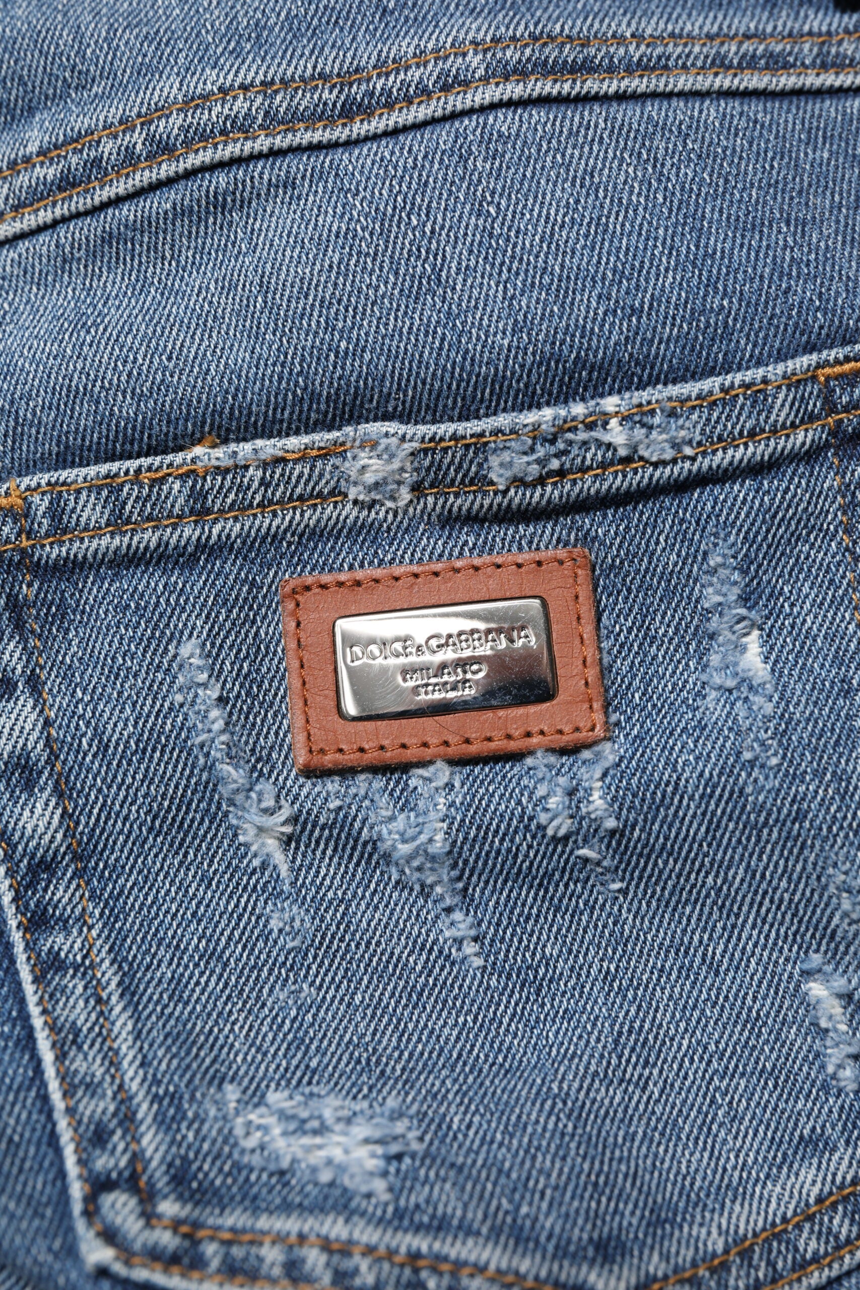 Indulge in the exquisite Dolce & Gabbana Blue PRETTY Tattered Skinny Denim Jeans, crafted in Italy for a figure-hugging silhouette that embodies timeless elegance and effortless sophistication.