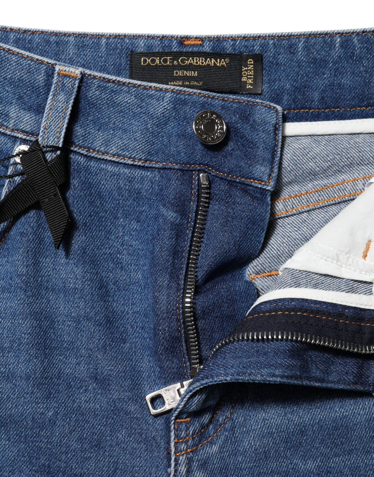 Elevate your wardrobe with Dolce & Gabbana's exquisite high waist tapered denim jeans, crafted in Italy from premium cotton for a timeless, luxurious fit that embodies sophistication.