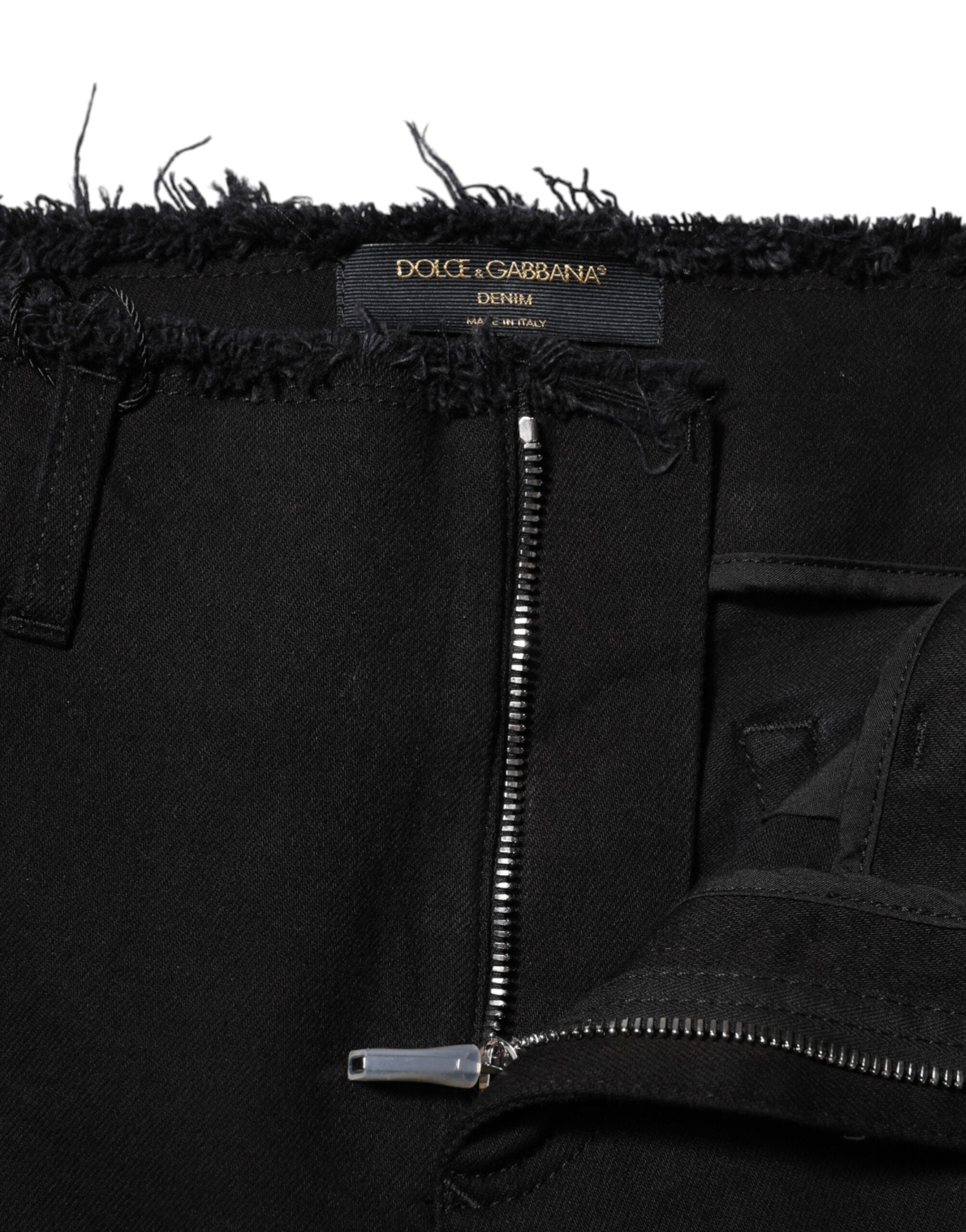 Elevate your wardrobe with Dolce & Gabbana's Black Cotton Mid Waist Flared Denim Jeans, where exquisite Italian craftsmanship meets timeless elegance for the discerning individual.