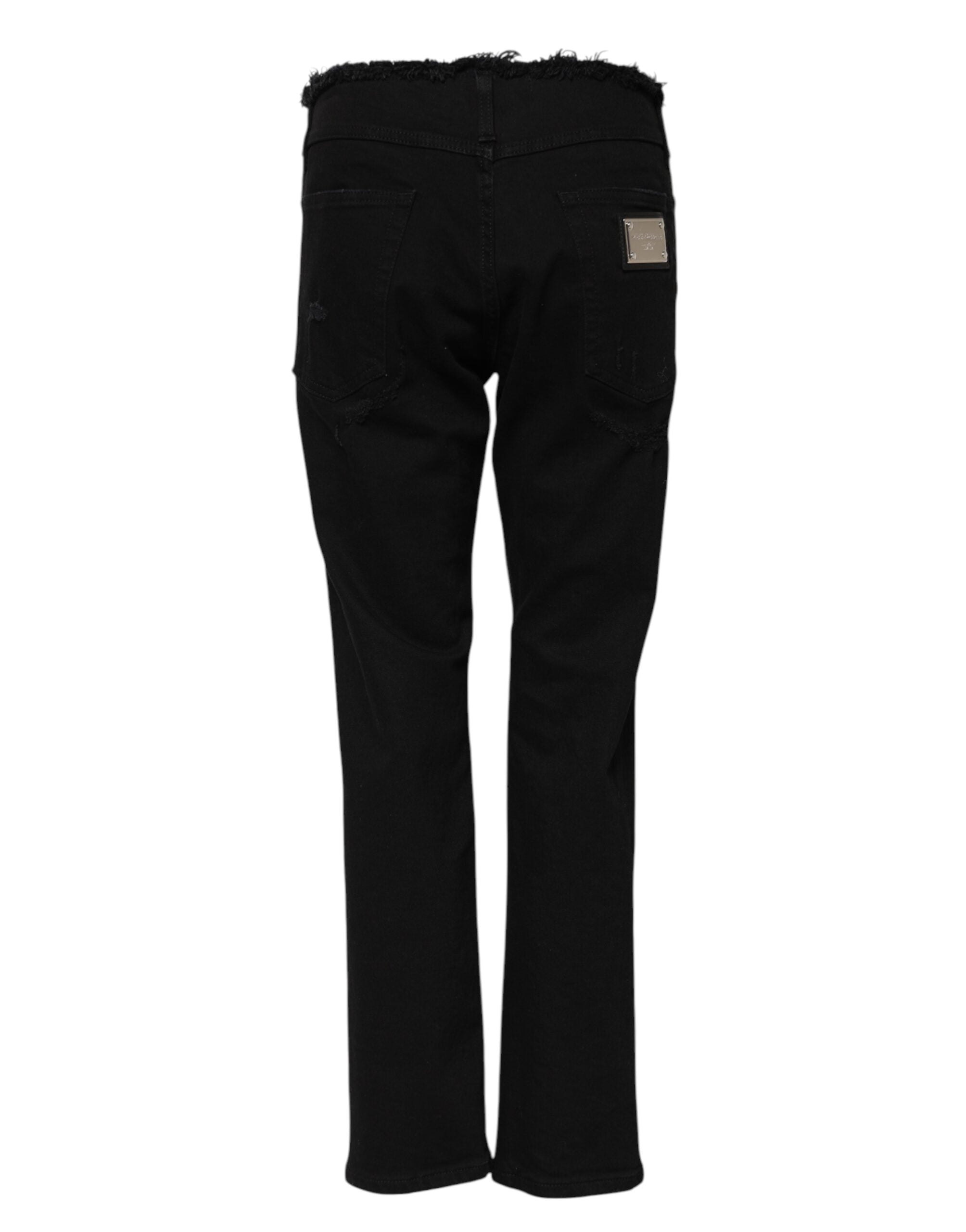 Elevate your wardrobe with Dolce & Gabbana's Black Cotton Mid Waist Flared Denim Jeans, where exquisite Italian craftsmanship meets timeless elegance for the discerning individual.