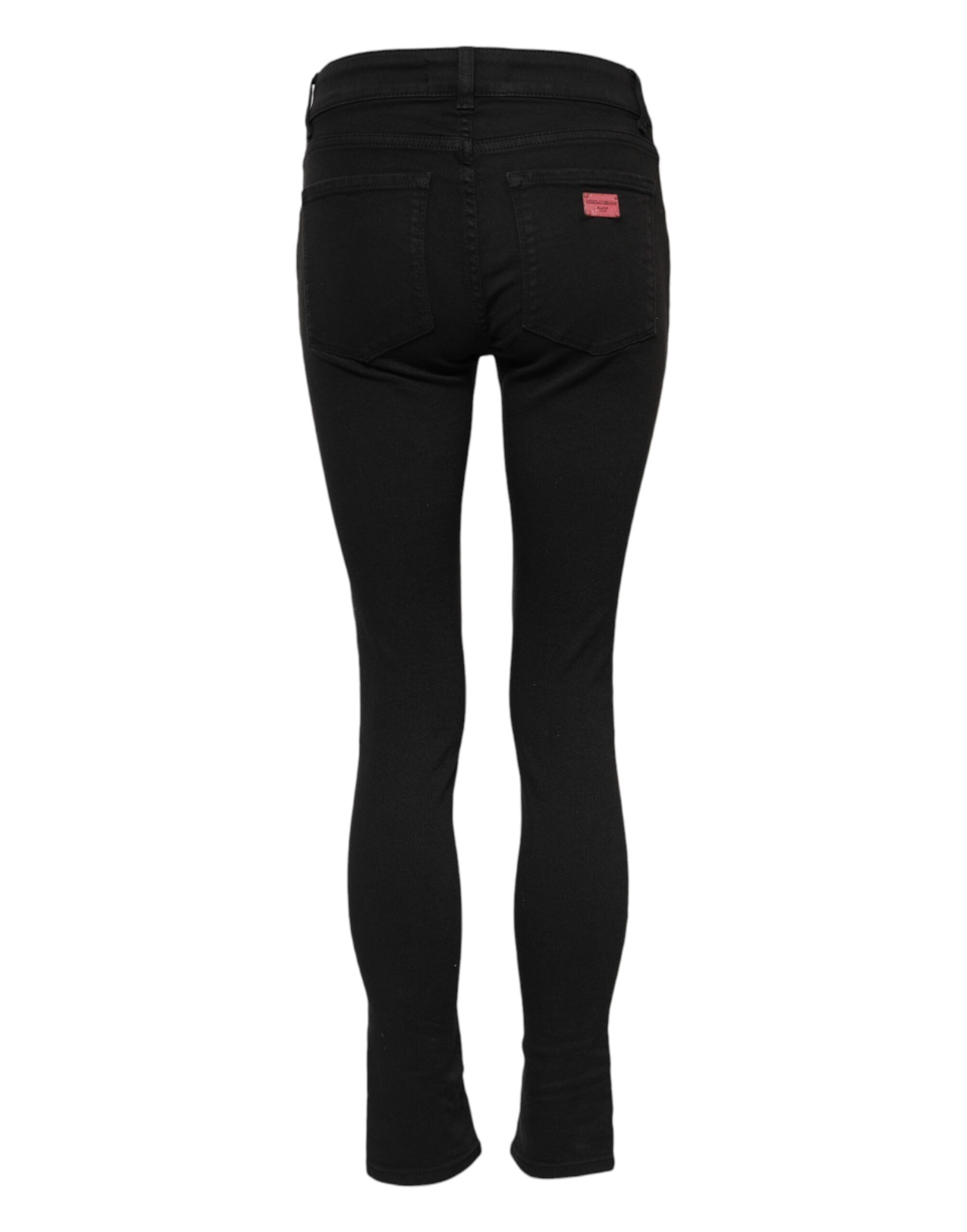 Indulge in the allure of Dolce & Gabbana's Black Cotton Skinny Mid Waist Denim Jeans, where exquisite Italian craftsmanship meets timeless elegance for the discerning individual.