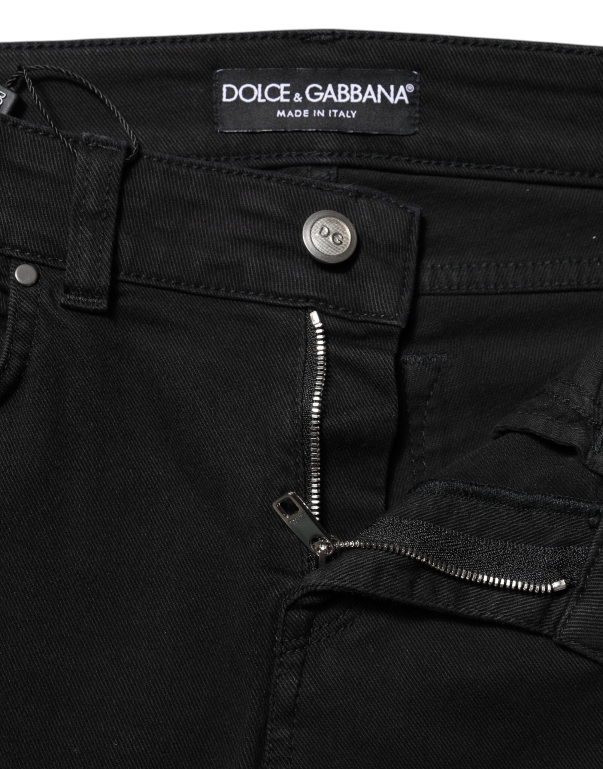 Indulge in the exquisite craftsmanship of Dolce & Gabbana's Black Cotton Skinny Mid Waist Denim Jeans, where luxurious materials meet timeless elegance, perfect for the discerning individual.