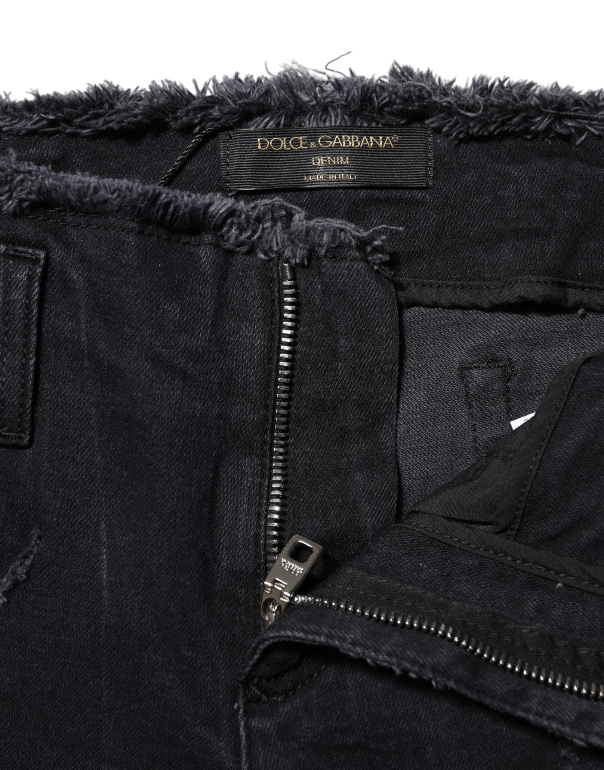 Elevate your wardrobe with Dolce & Gabbana's Black Cotton Tattered Skinny Denim Jeans, a masterpiece of Italian craftsmanship that embodies allure and sophistication.
