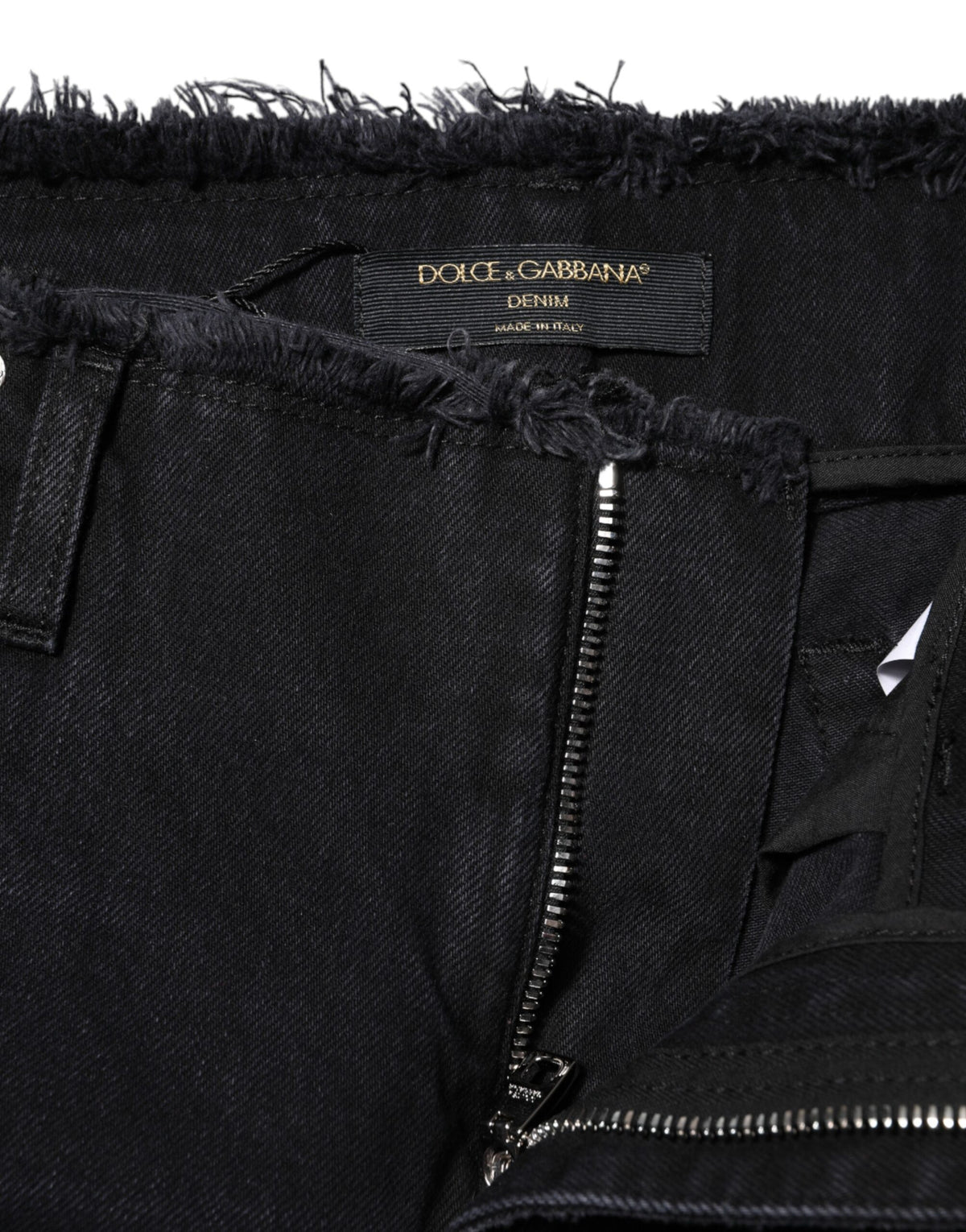 Elevate your style with Dolce & Gabbana's Black Cotton Tattered Mid Waist Denim Jeans, a luxurious blend of exquisite craftsmanship and rebellious elegance, made in Italy.