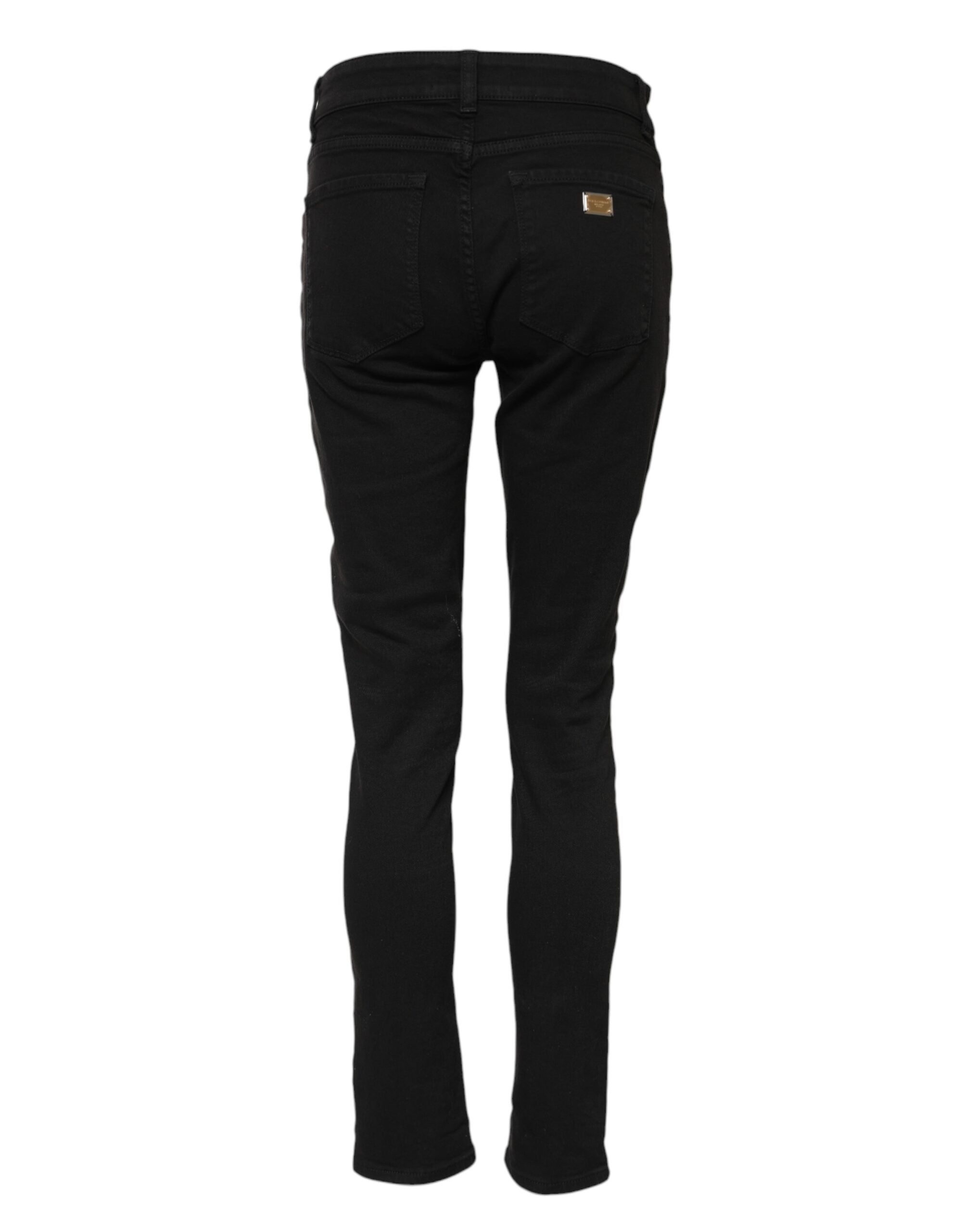 Indulge in the exquisite Dolce & Gabbana Black Cotton Logo Skinny Mid Waist Denim Jeans, where Italian craftsmanship meets timeless elegance for the discerning individual.