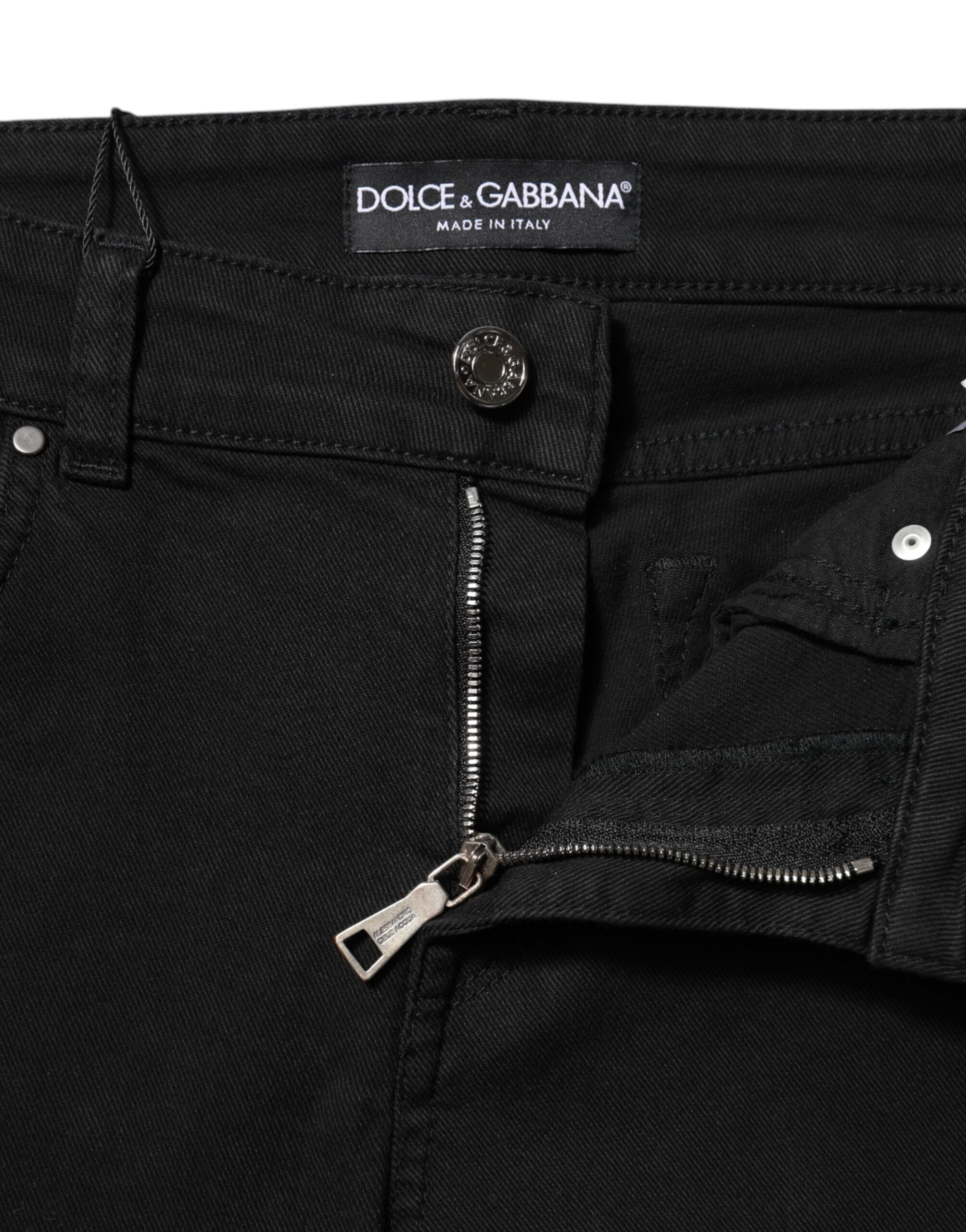 Elevate your wardrobe with Dolce & Gabbana's Black Cotton Logo Skinny Mid Waist Denim Jeans, where exquisite Italian craftsmanship meets timeless elegance for the discerning individual.