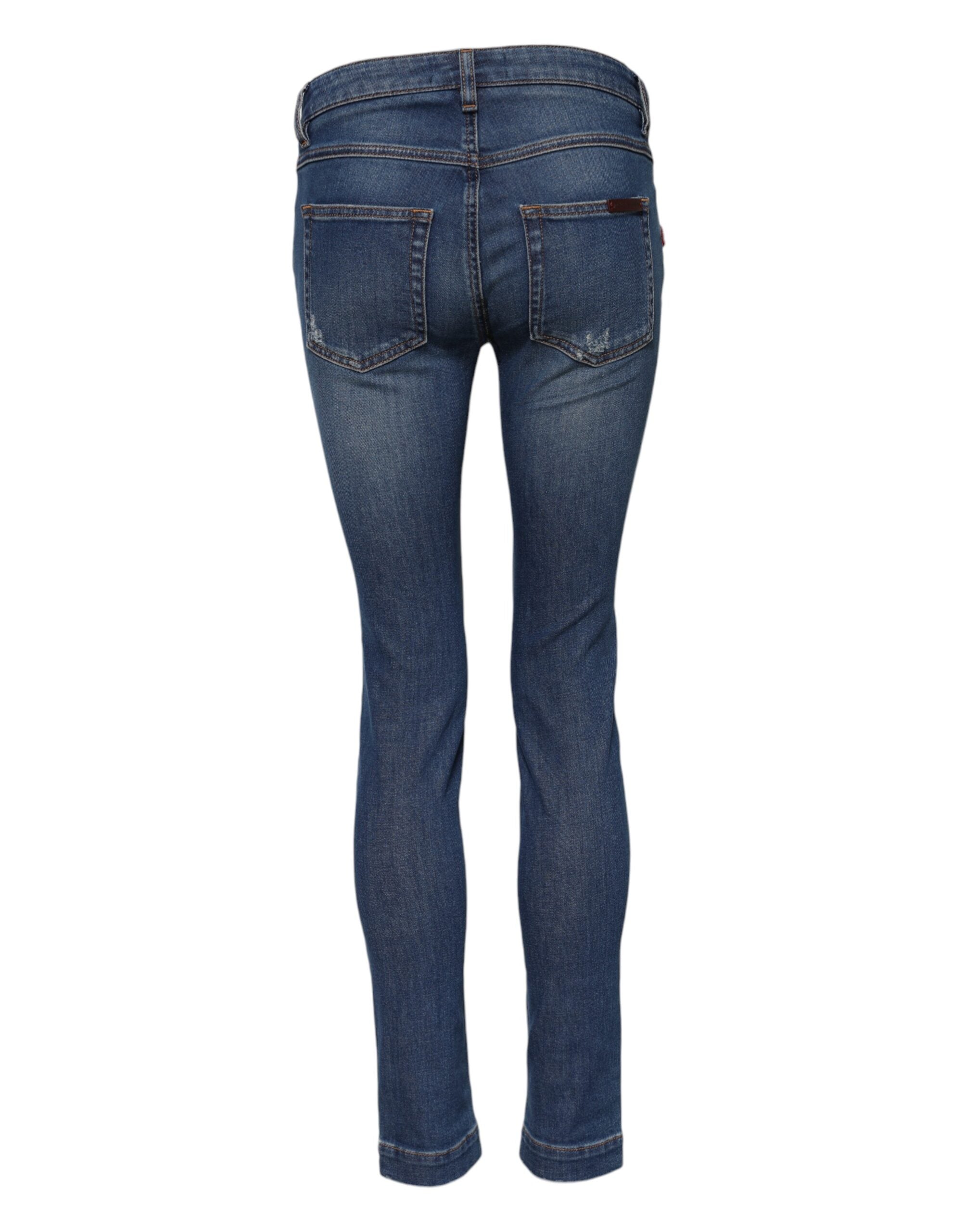 Indulge in the exquisite Dolce & Gabbana Blue Cotton Low Waist Skinny Denim Jeans, where Italian craftsmanship meets luxurious floral embroidery for a timeless silhouette.