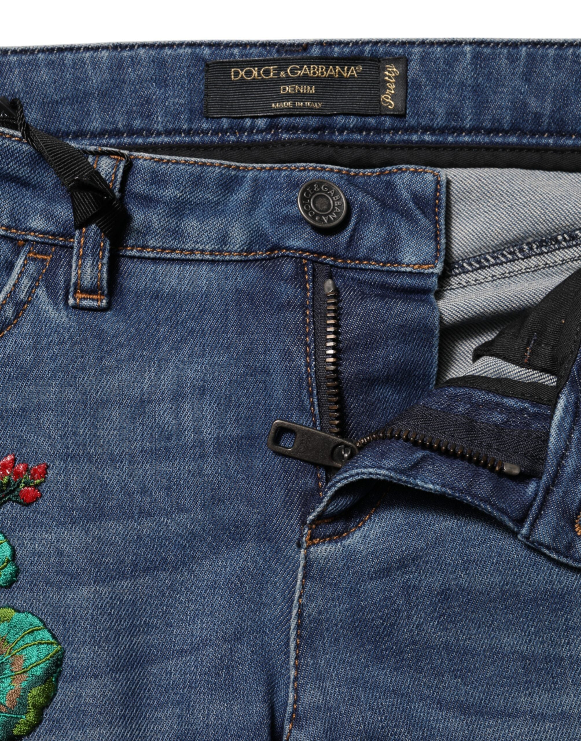 Indulge in the exquisite Dolce & Gabbana Blue Cotton Low Waist Skinny Denim Jeans, where Italian craftsmanship meets luxurious floral embroidery for a timeless allure.