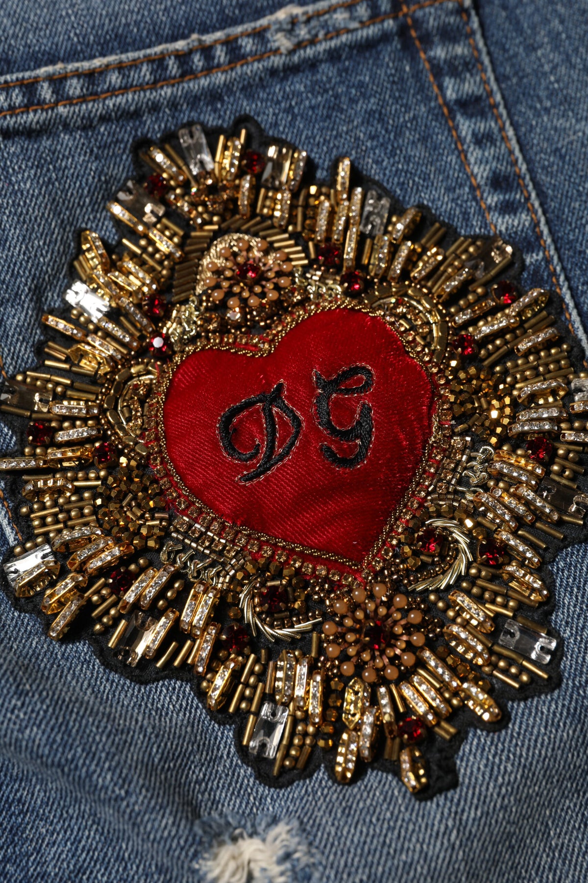 Indulge in the luxurious allure of Dolce & Gabbana's Blue Cotton Boyfriend Tattered Denim Jeans, where exquisite craftsmanship meets timeless elegance for the discerning individual.