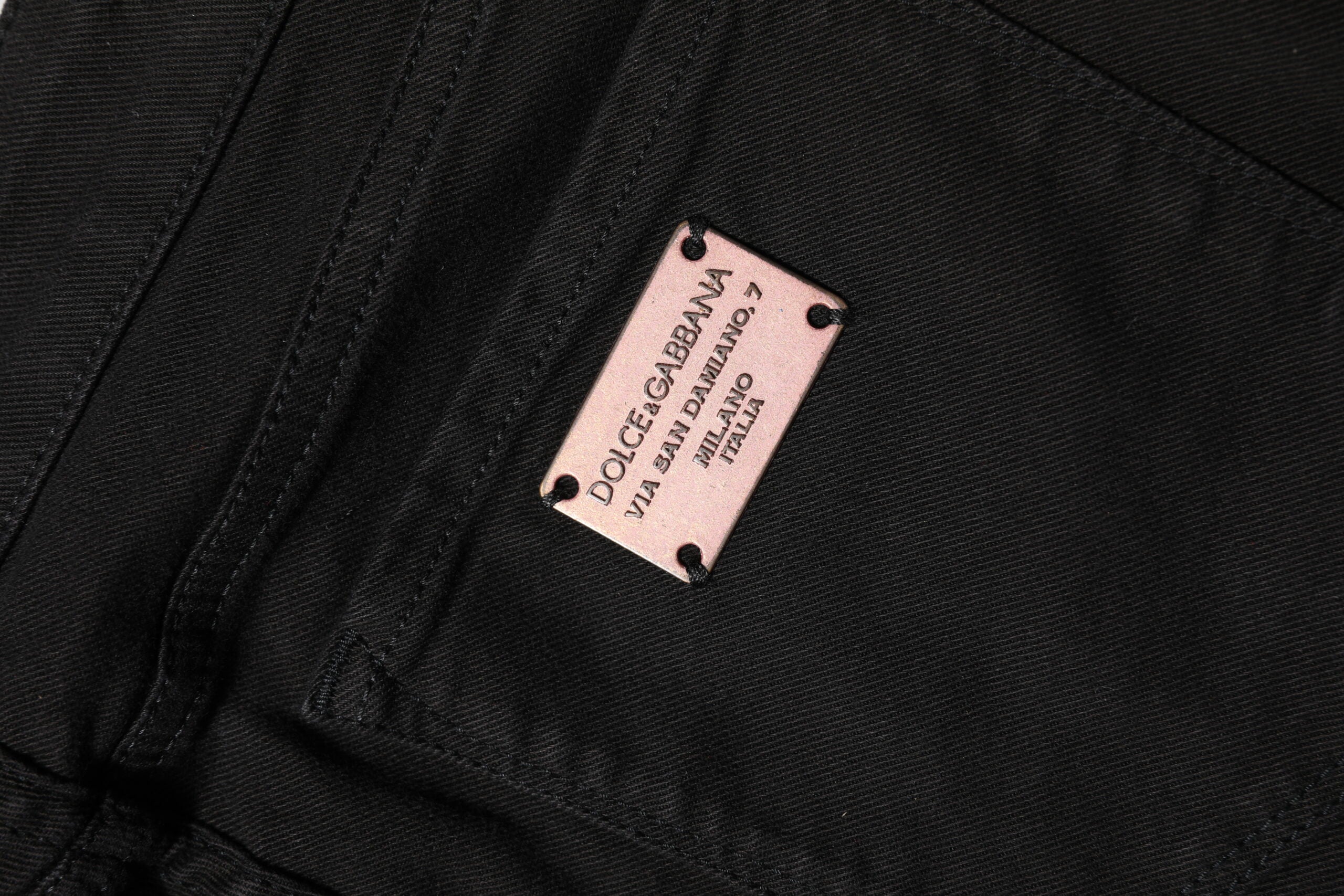 Indulge in the exquisite allure of Dolce & Gabbana Black Cotton Skinny Mid Waist Denim Jeans, where luxurious craftsmanship meets timeless elegance for the discerning individual.