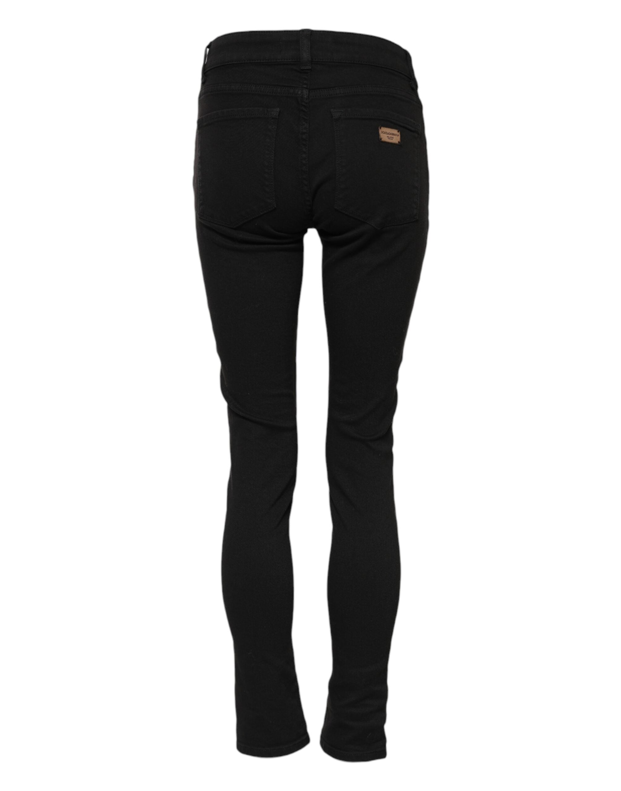 Elevate your wardrobe with Dolce & Gabbana's Black Cotton Skinny Mid Waist Denim Jeans, where exquisite Italian craftsmanship meets timeless elegance for the discerning individual.