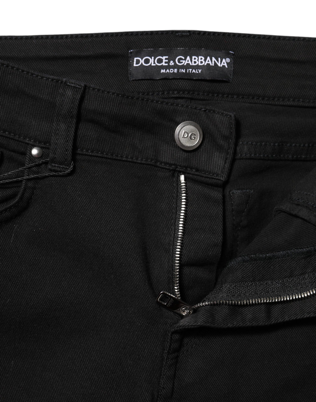 Indulge in the exquisite craftsmanship of Dolce & Gabbana's Black Cotton Skinny Mid Waist Denim Jeans, a timeless luxury essential that enhances your silhouette with elegance.