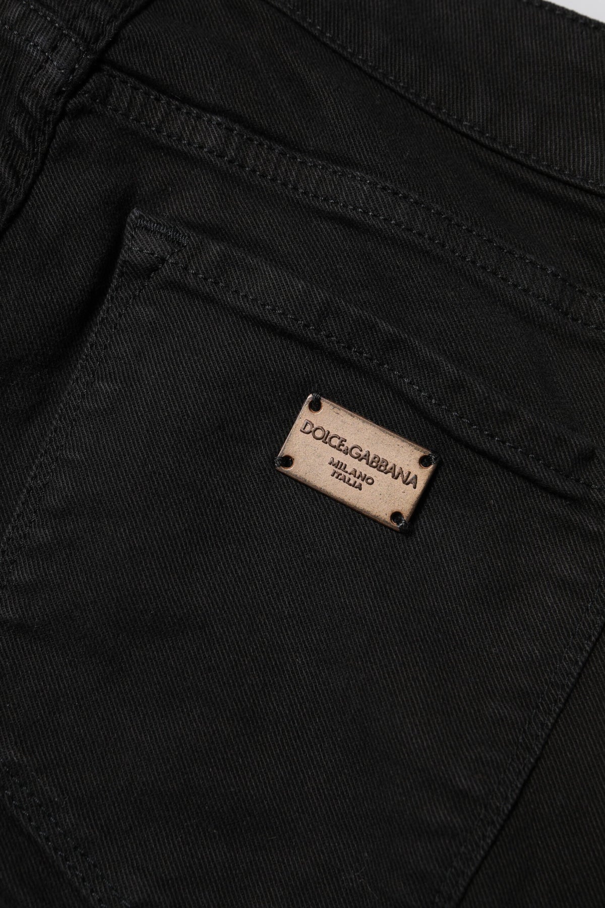 Indulge in the exquisite craftsmanship of Dolce & Gabbana's Black Cotton Skinny Mid Waist Denim Jeans, a timeless luxury that enhances your silhouette with elegance and confidence.