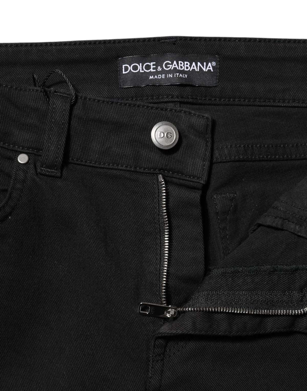 Elevate your wardrobe with Dolce & Gabbana's Black Cotton Skinny Mid Waist Denim Jeans, a luxurious blend of comfort and sophistication, crafted in Italy for the discerning individual.