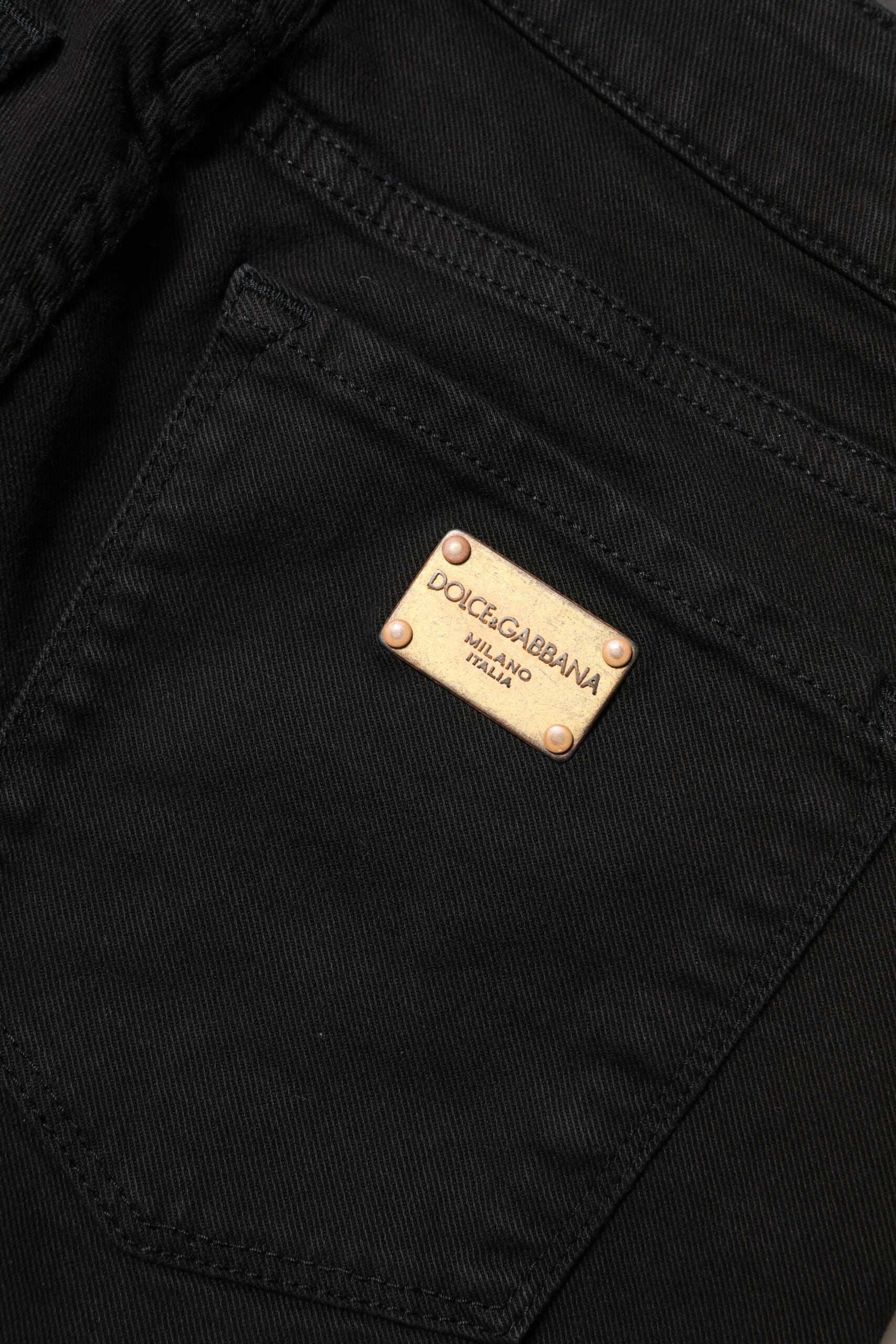 Discover the allure of Dolce & Gabbana's Black Cotton Skinny Mid Waist Denim Jeans, where exquisite Italian craftsmanship meets luxurious style for the discerning individual.