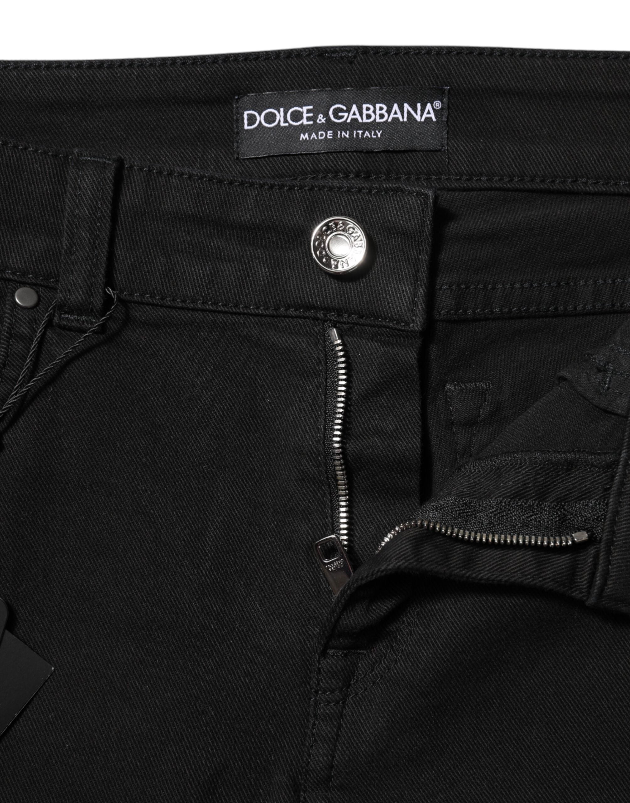 Indulge in the exquisite allure of Dolce & Gabbana's black cotton logo skinny mid waist jeans, where timeless luxury meets impeccable craftsmanship for the discerning individual.